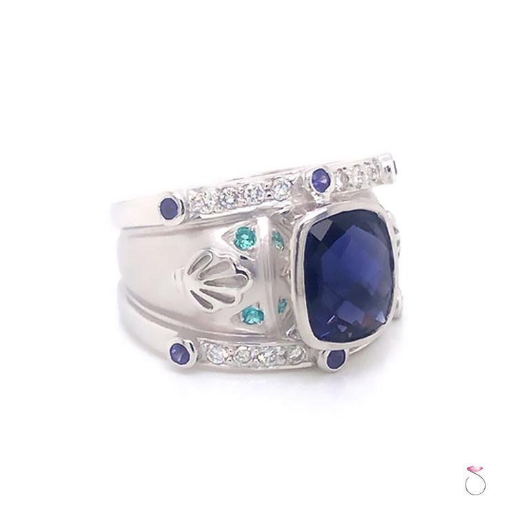 This magnificent natural Tanzanite ring in 18k white gold is a real beauty. Featuring a large cushion shape Tanzanite with checker faceting, measuring approximately 10.17 mm x 7.76 mm x 5.56 mm with an estimated total weight of 3.50 carats. The