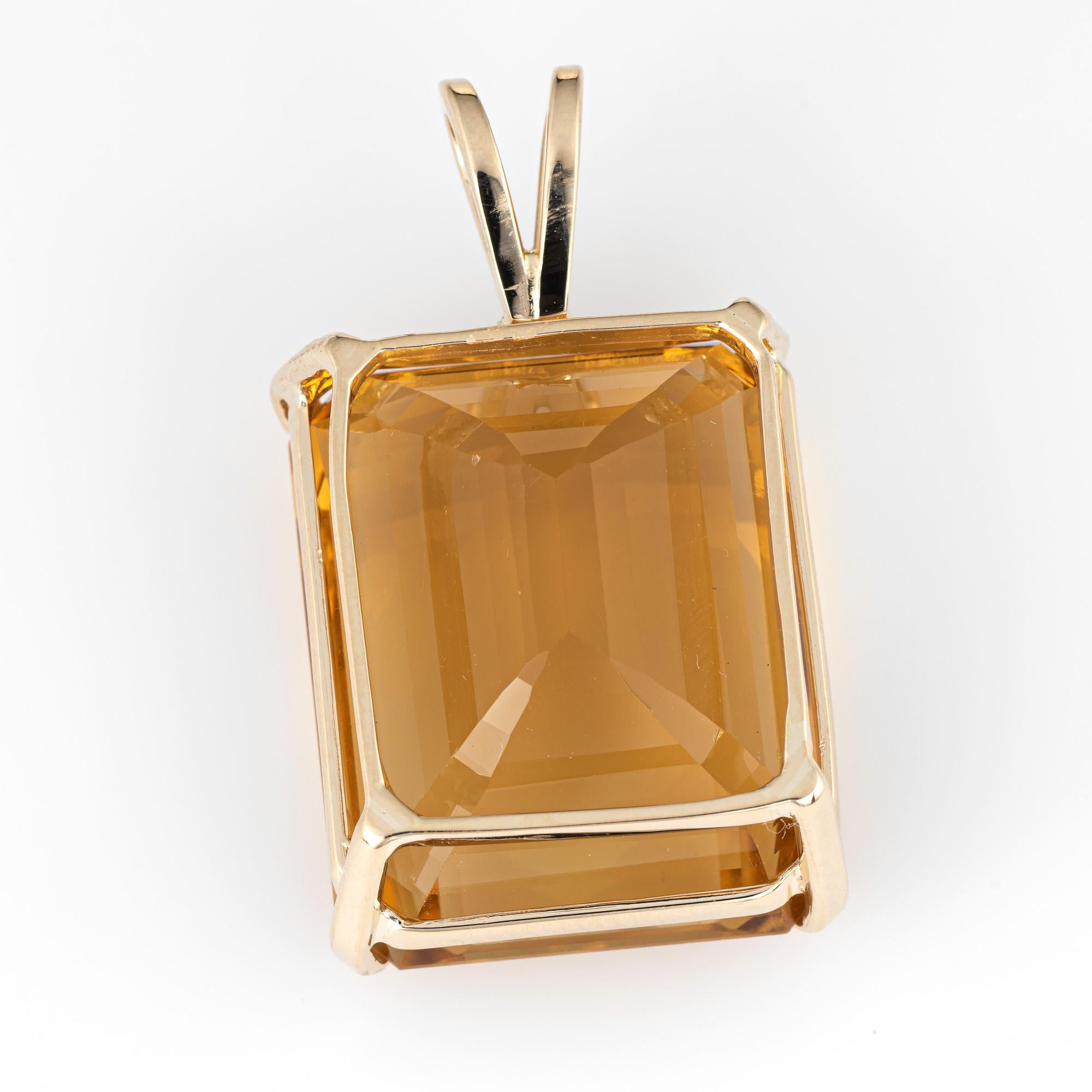 Finely detailed large vintage citrine pendant (circa 1960s to 1970s) crafted in 14k yellow gold.   

The citrine measures 22mm x 18mm (estimated at 37 carats). The citrine is in very good condition (few small chips visible under a 10x loupe).

The