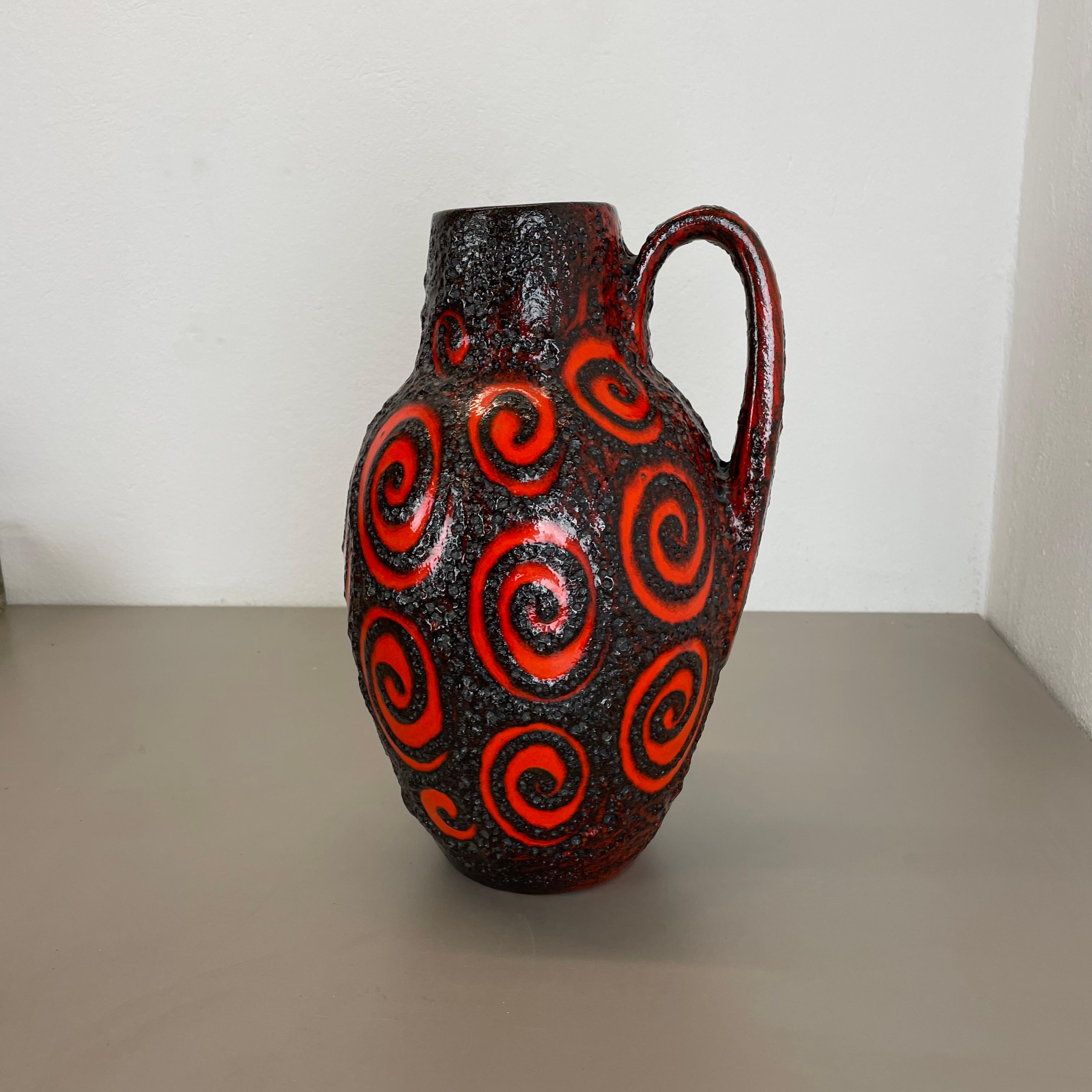 Article:

Fat lava art vase extra large version


Model: 279-38


Producer:

Scheurich, Germany



Decade:

1970s


Description:

This original vintage vase was produced in the 1970s in Germany. It is made of ceramic pottery in fat lava optic with