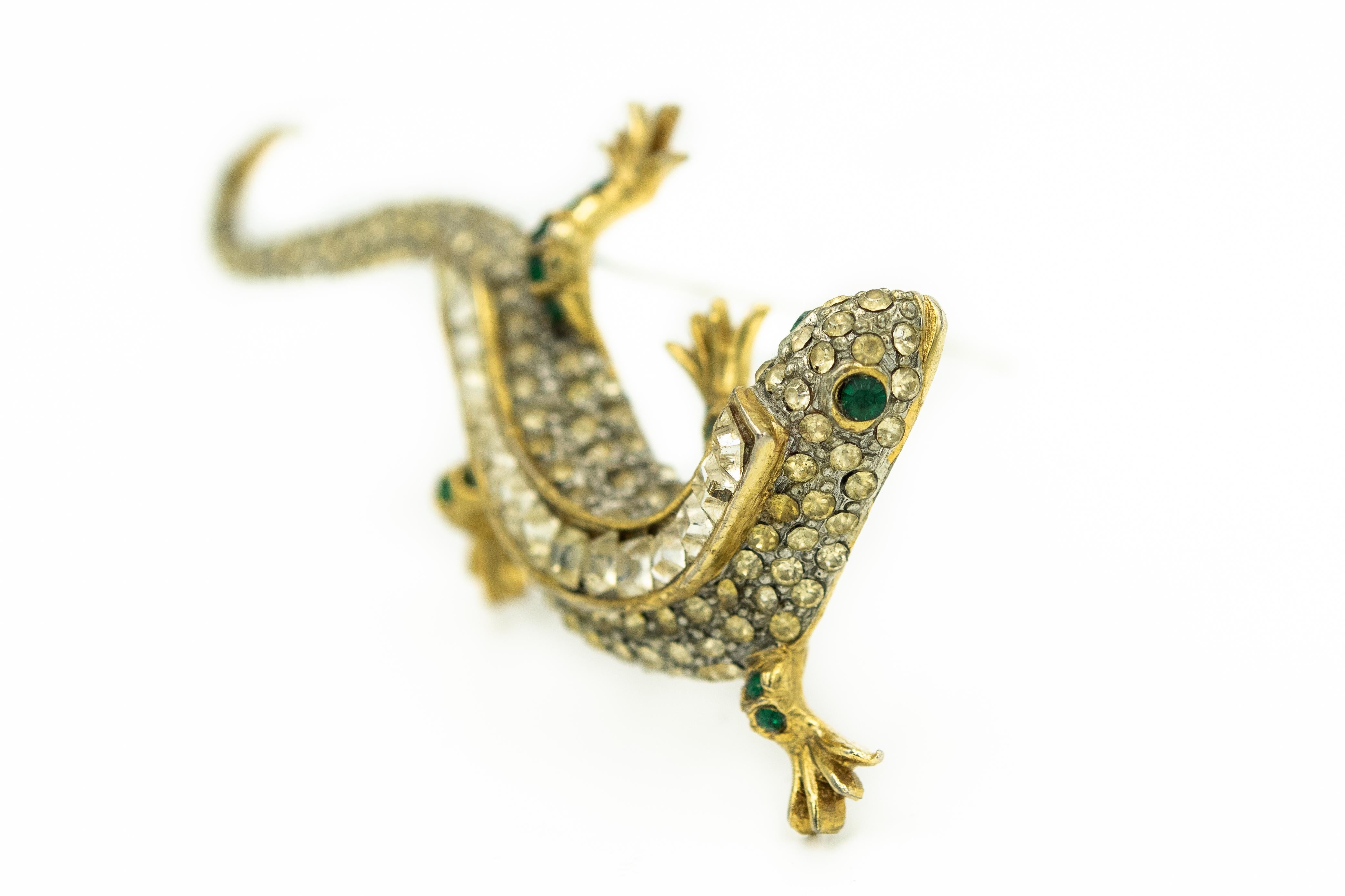 Exceptional salamander lizard gecko made by Maresco is the 1980s. He is bold, and flashy in pristine condition. The gold plated brass animal is totally encrusted with Swarovski rhinestones from his nose to the tip of his tail. He has gold plated