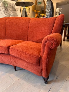 Large 4 seater semi circular wingback sofa in lush orange velvet