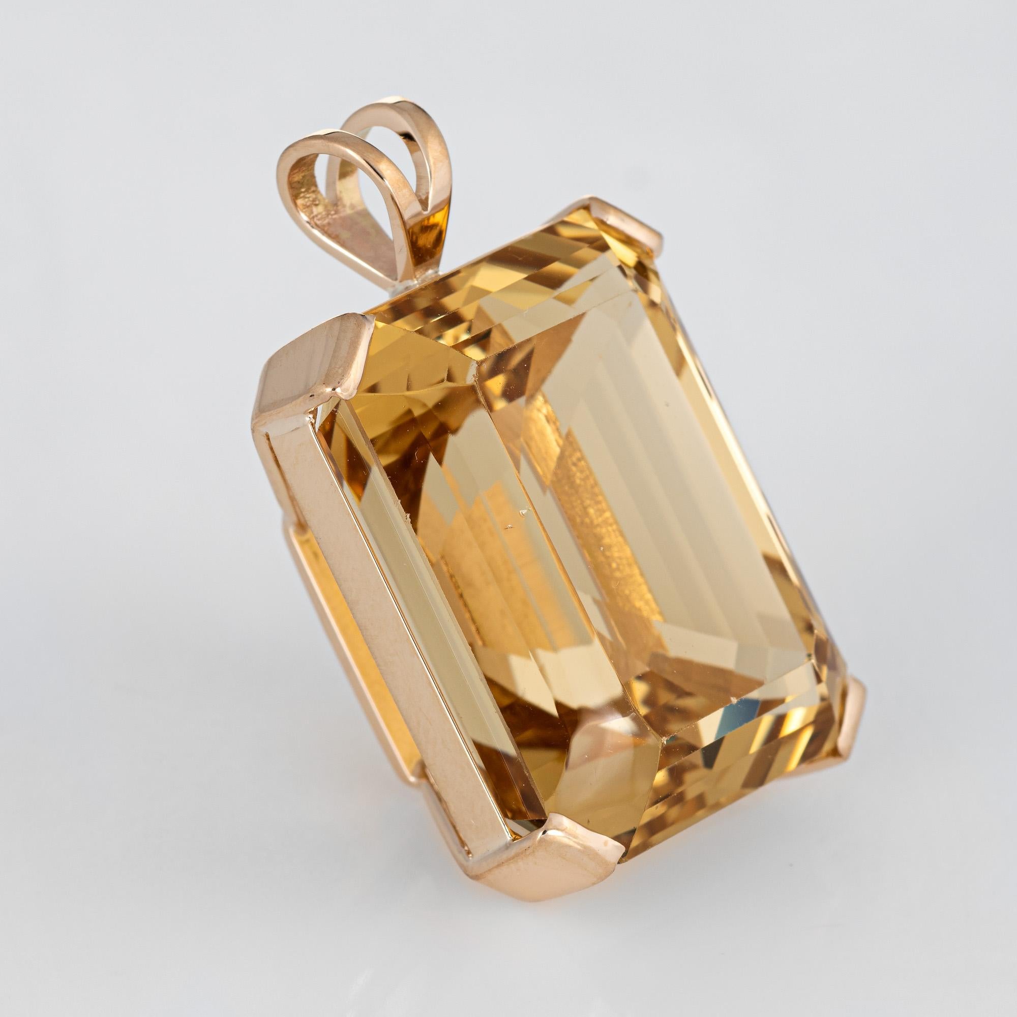 Finely detailed large vintage citrine pendant (circa 1960s to 1970s) crafted in 14k yellow gold.   

The citrine measures 23mm x 18mm (estimated at 43 carats). The citrine is in very good condition (few small chips visible under a 10x loupe).

The