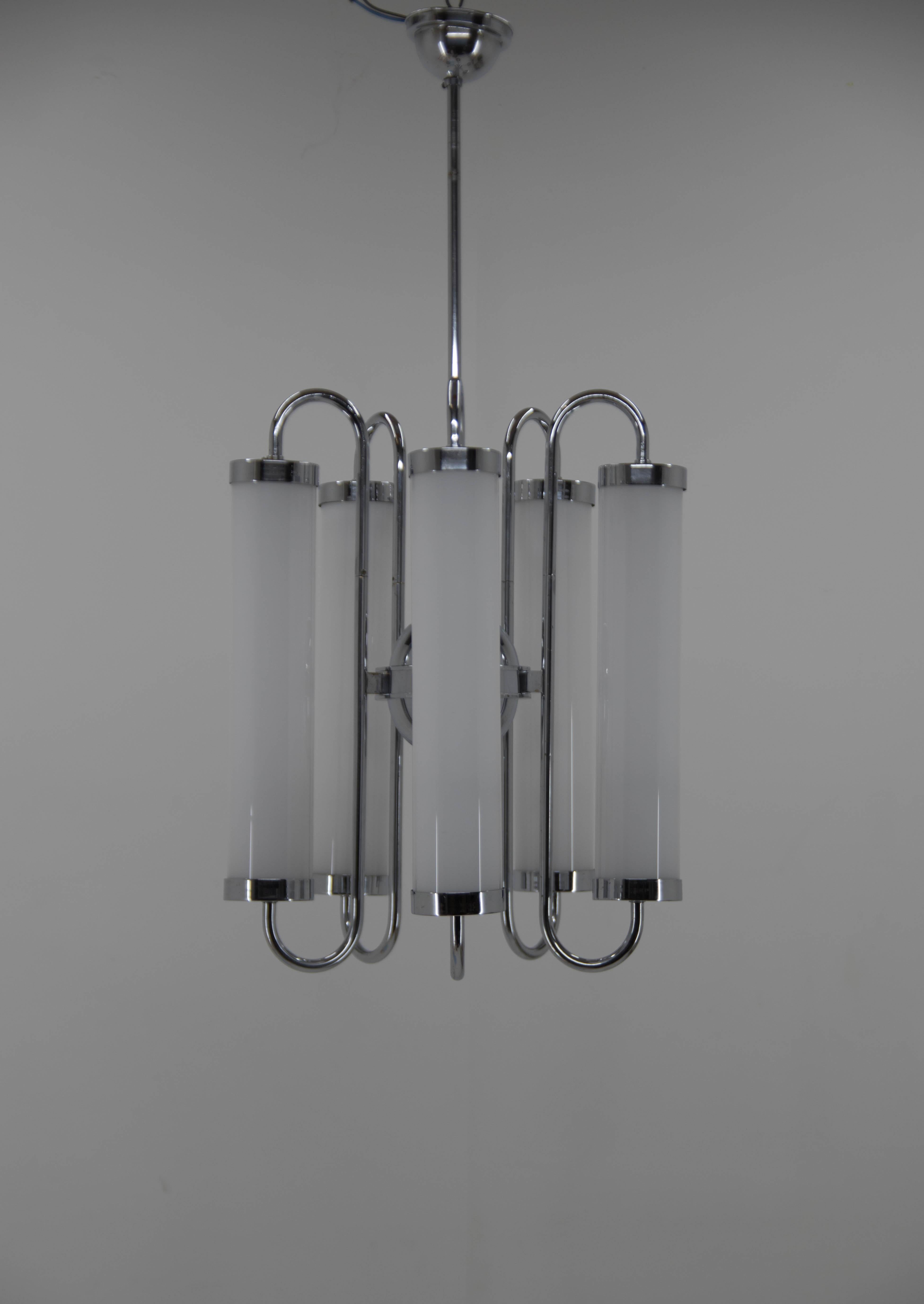 Chrome-plated Bauhaus or Art Deco chandelier
Rewired, polished
New hand made blown opaline glass shades
Original ceiling canopy with minor cracks could be replaced for another one on demand
5x40W E25-E27 bulbs
US wiring compatible.
