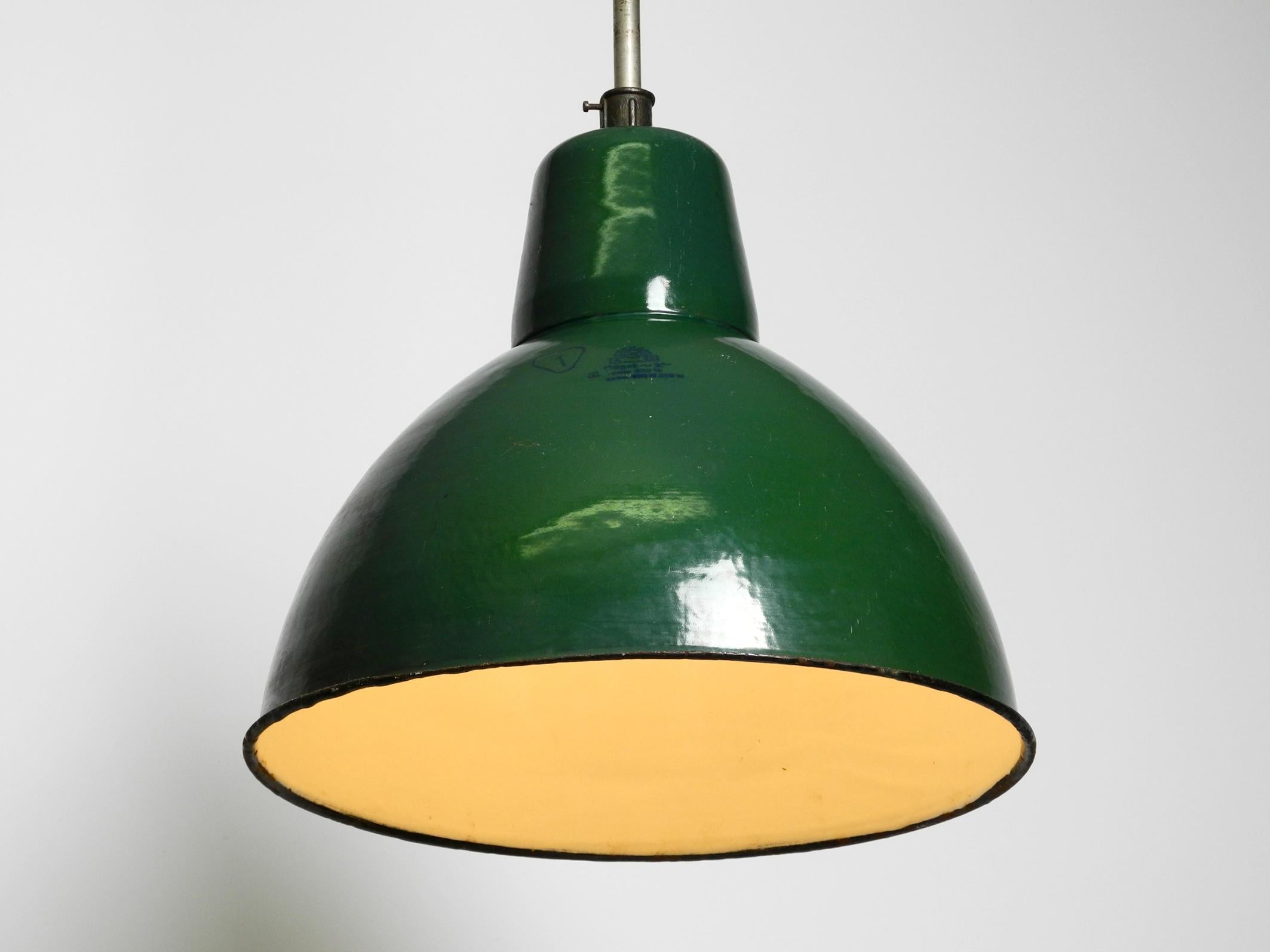 Beautiful mid century Industrial enameled metal factory lamp from France.
Glossy dark green surface, white inside. Good vintage condition with great patina.
100% original condition. Fully functional.
Cable renewed due to age. With original E40