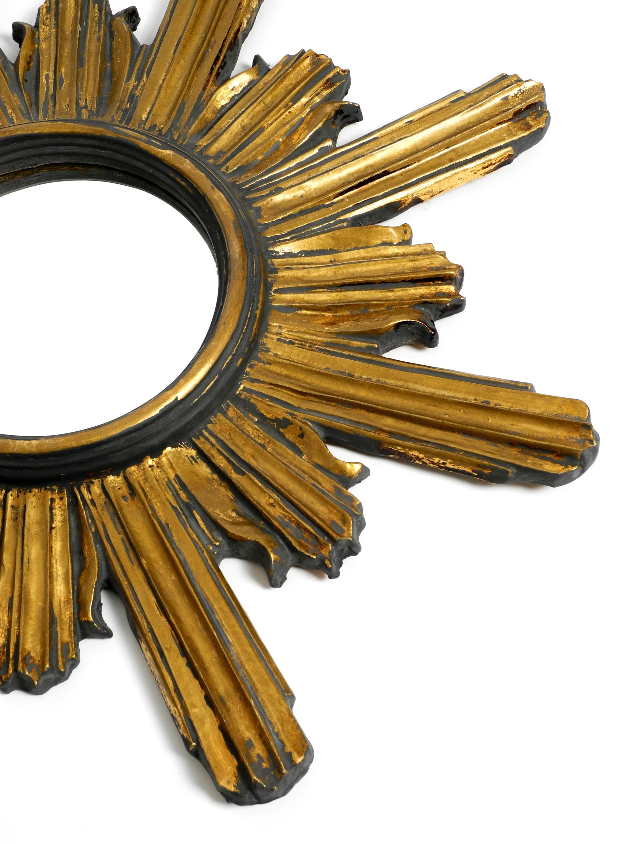Italian Large 50s Sunburst Wall Mirror Made of Wood and Resin, Gilded and in Grey Color For Sale