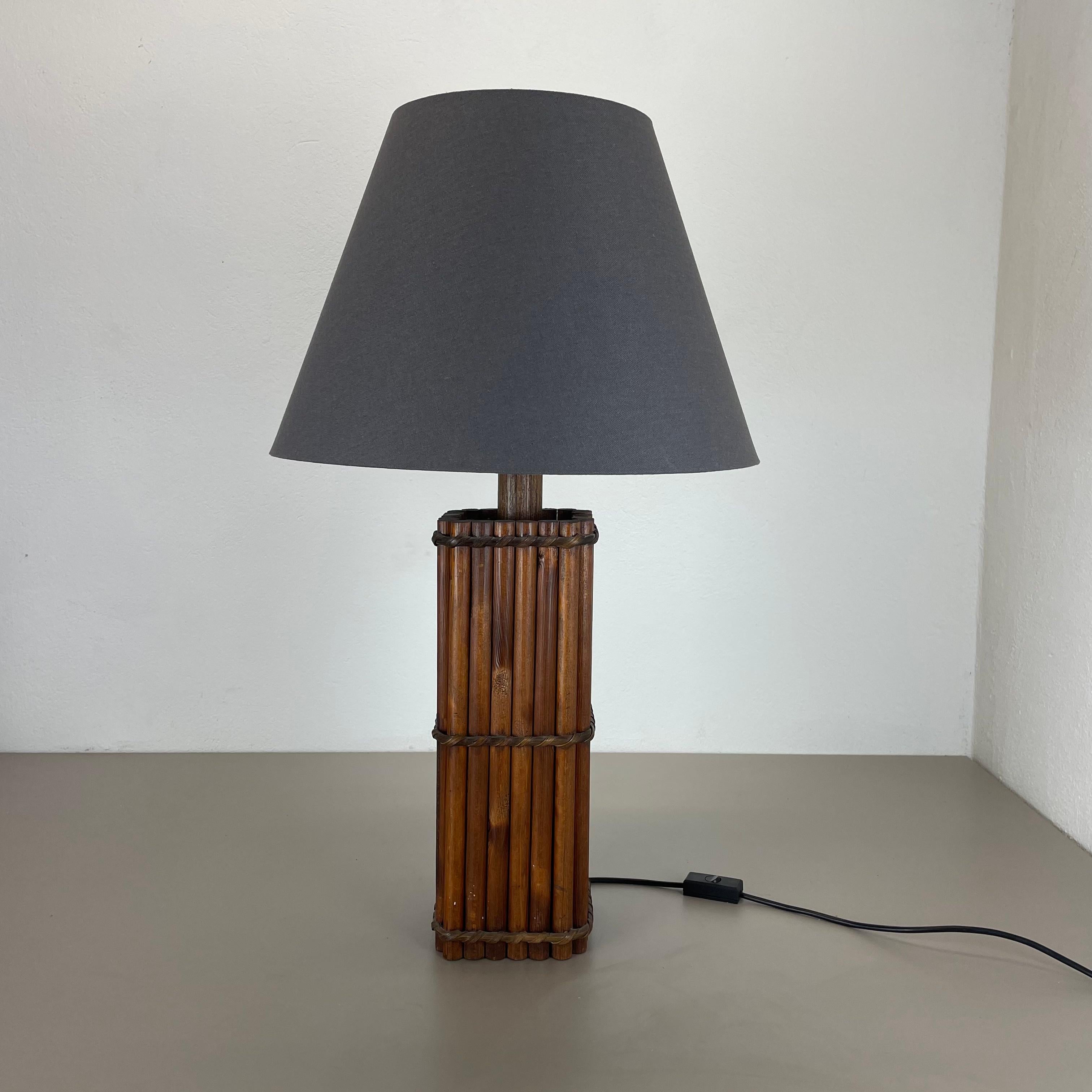 Article:

modernist wooden table light 


Origin:

Italy


Decade:

1970s



This original vintage light was designed and produced in the 1970s in Italy. The light base is made of solid wooden tube form parts with a nice knotting