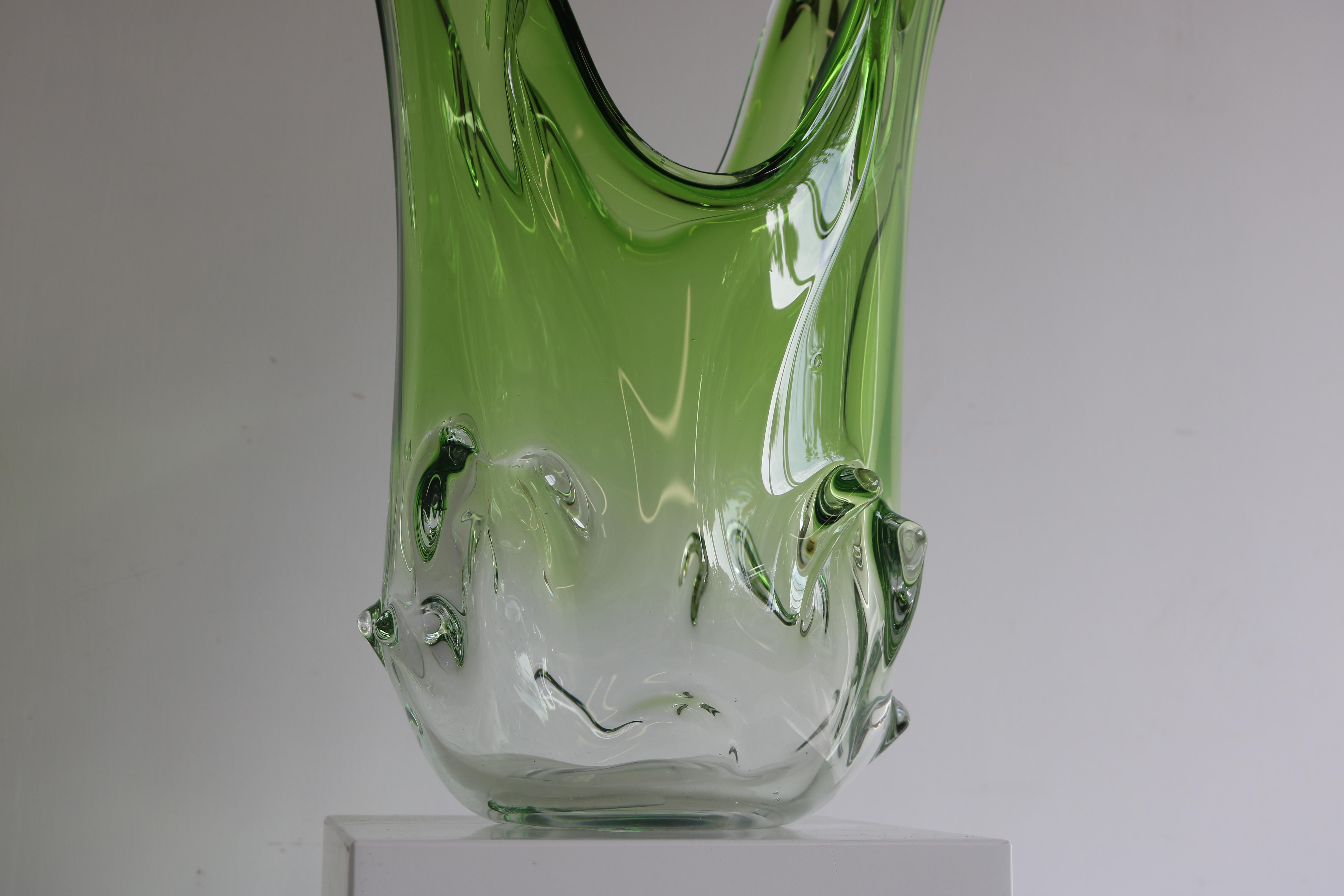 Add a touch of elegance to your home décor with this magnificent Murano glass vase. Exceptional large model of 20 inch & weighing an impressive 5.4kg! Crafted using the sommerso technique, this vase features a beautiful green and clear glass color