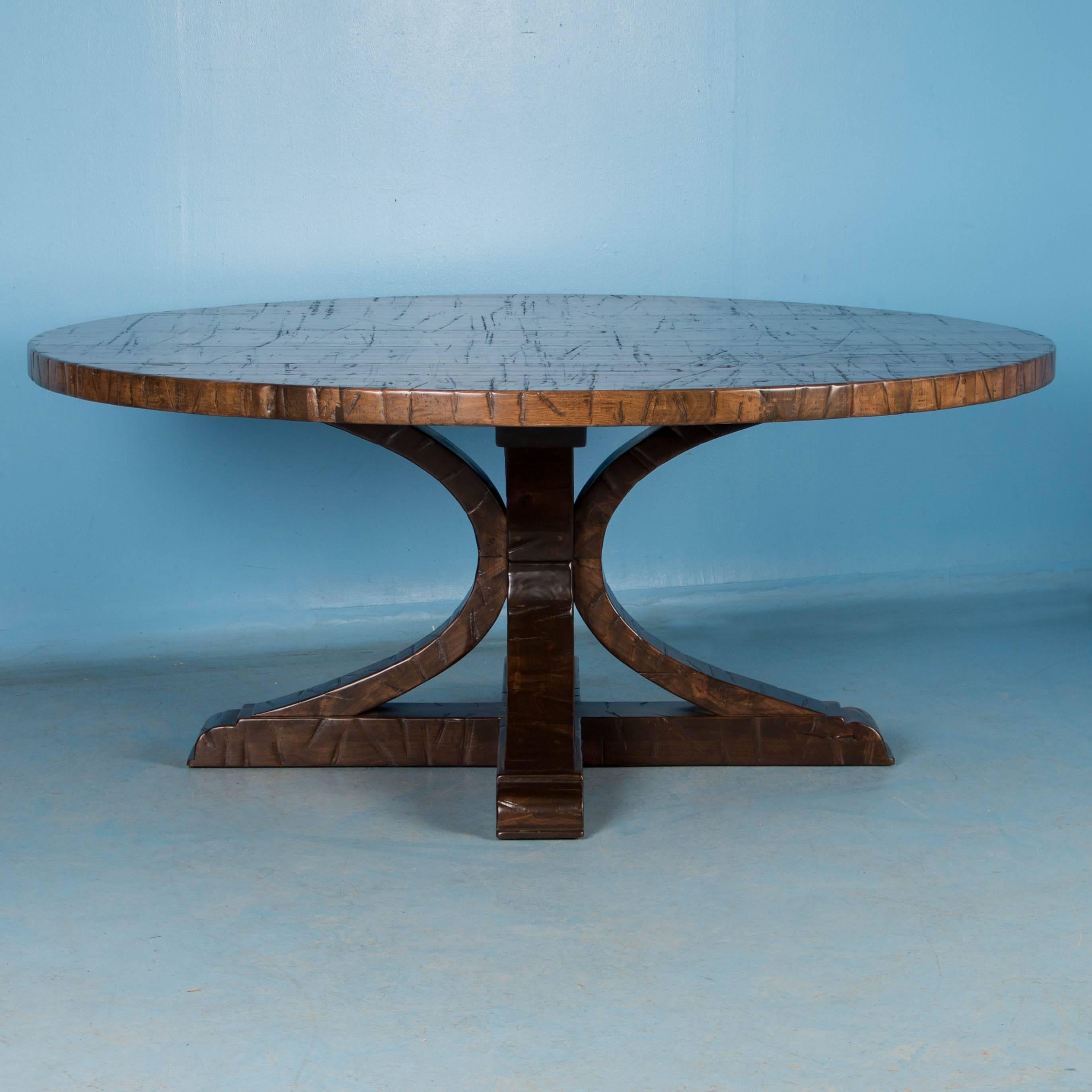 This large round dining table was custom-made using reclaimed maple boxcar flooring. The distressed wood is a result of years of moving cargo through the train’s boxcars – it has been sanded, stained and given a strong finish for daily use. At six