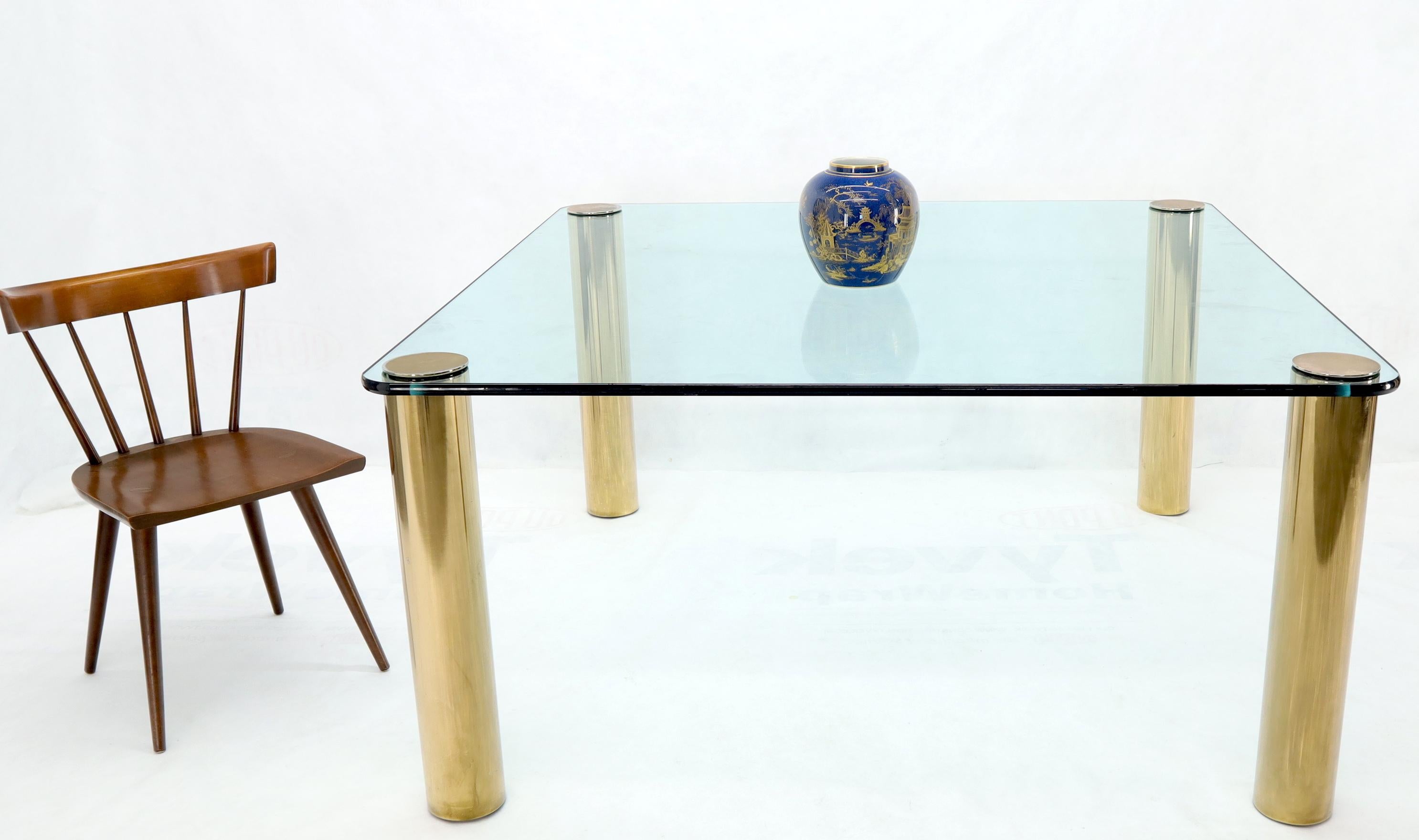 Mid-Century Modern large thick glass 5'x5' square top dining conference table on round brass cylinder legs attributed to Pace.