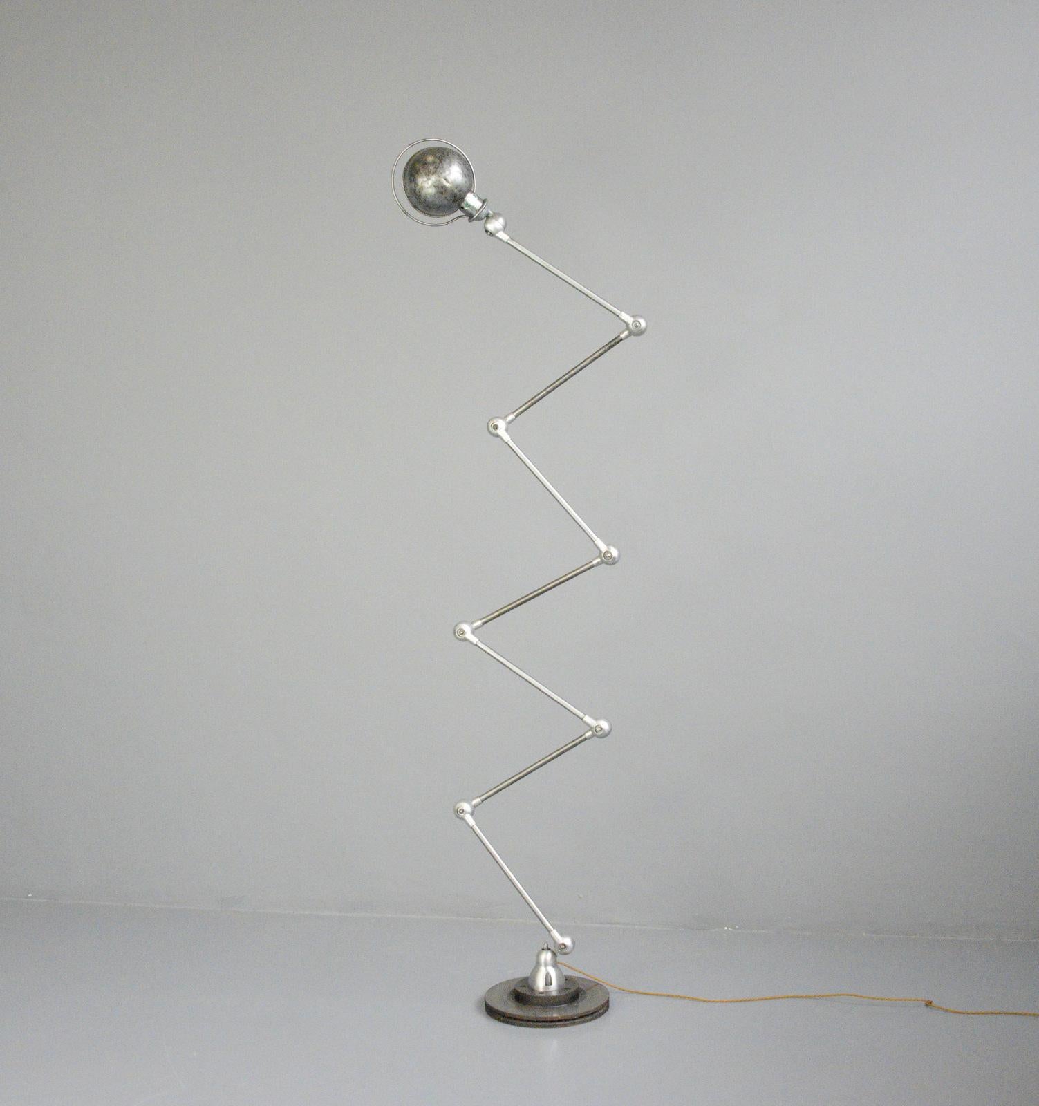 Large 7 arm floor standing jielde lamp Circa 1950s

- Brushed steel arms 
- Remote control On/Off
- Takes E27 fitting bulbs
- Design by Jean Louis Domecq for Jielde
- French ~ 1950s
- Stands at 200cm tall
- Shade measures 20cm