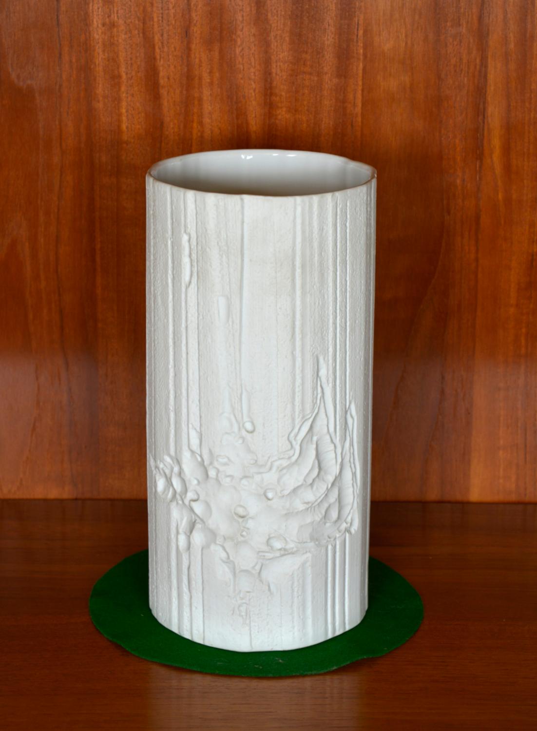 This original bisque porcelain OP Art vase was designed by Heinrich Fuchs in the 1970s for Hutschenreuther, Germany. This beautifully hand sculptured piece stands at a foot high and is made from matt bisque porcelain, decorated with a stunning