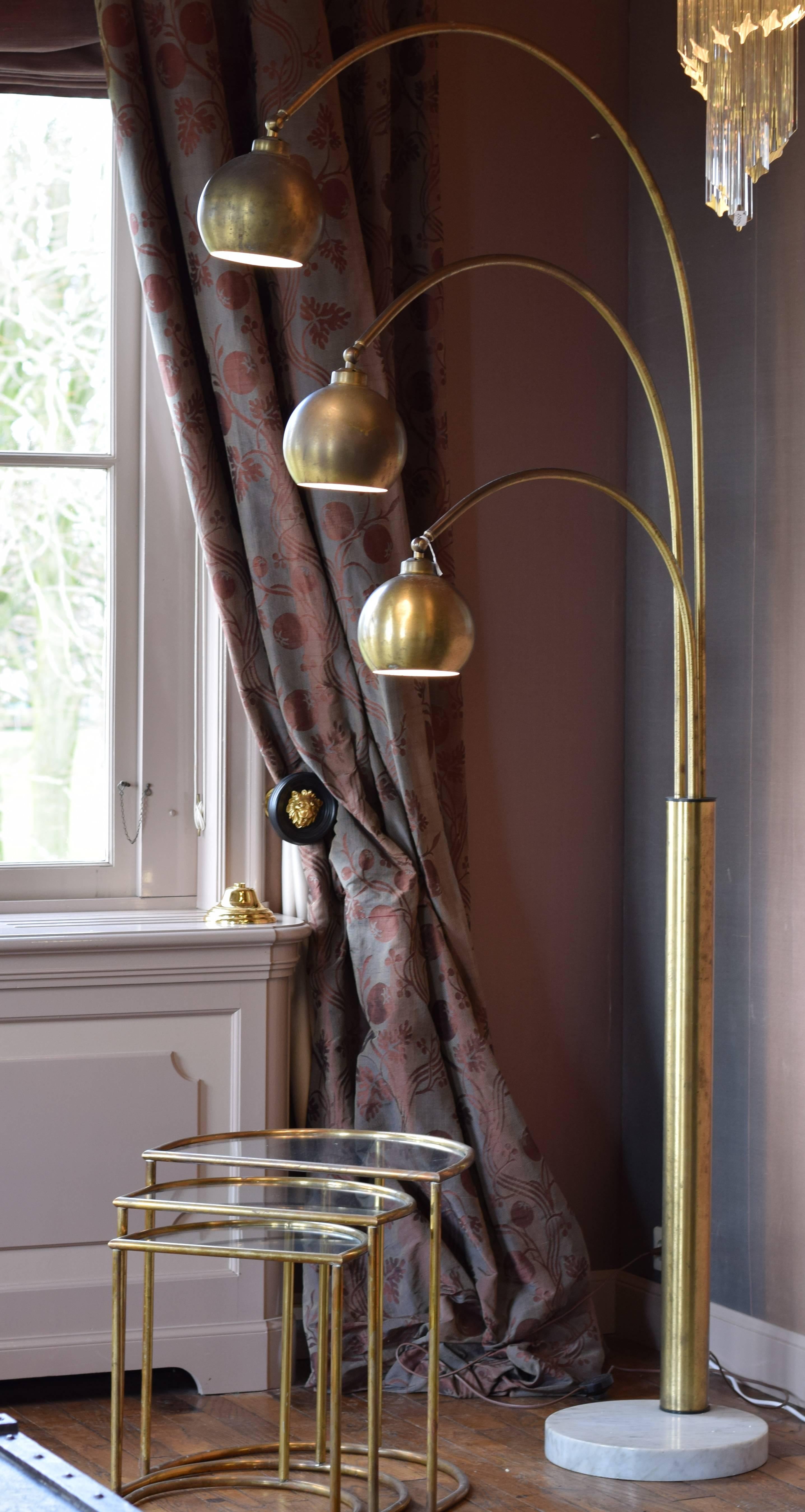Beautiful three-light floor lamp designed in the 1970s by the Italian designer Angelo Lelli.
The lamp is made from brushed brass on a marble foot. The brass is in a beautiful condition, however there are some signs of aging like small oxidation