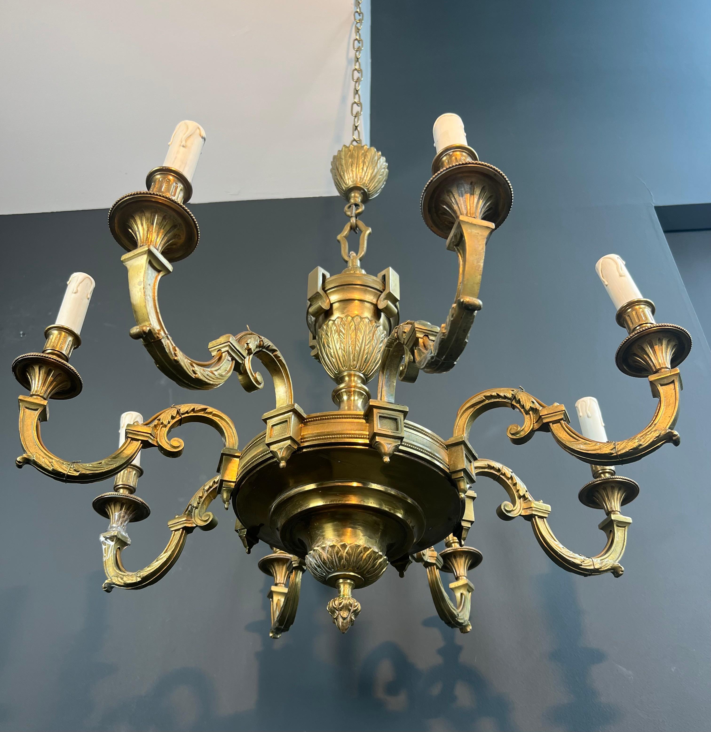 This very nice large 8 arms chandelier is made of finely chiseled bronze. This is a French work in the style of Louis the 16th by Lucien Gau. Circa 1940