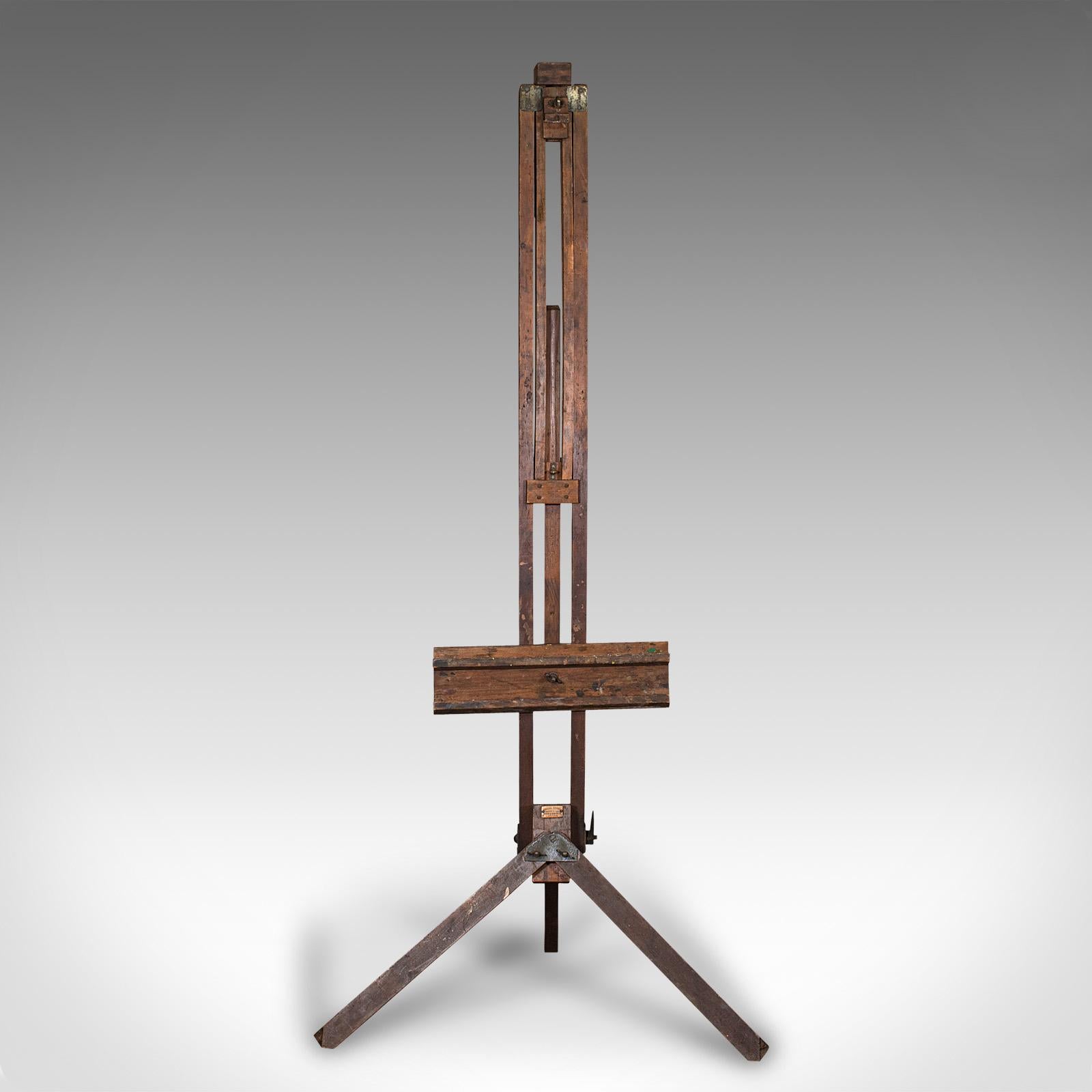 This is a very large antique adjustable easel. An English, pitch pine artist's rest, dating to the late Victorian period, circa 1900.

Offers superior versatility for the larger masterpiece or smaller composition
Displays a desirable aged patina