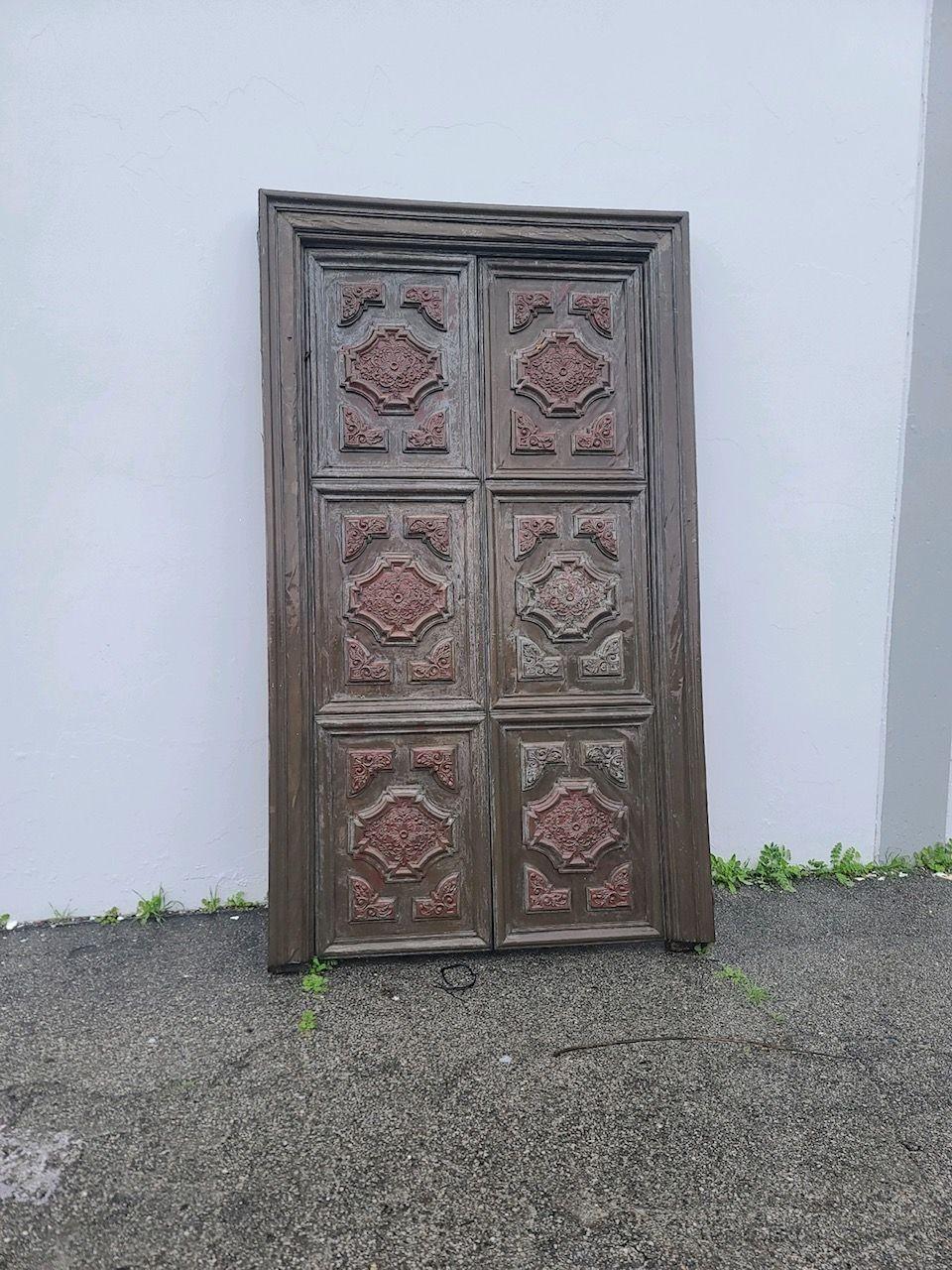 Large 8' multipaneled bronze-covered walnut interior double doors fixed to their original door frame featuring multiple regency crown molding along the front of each door face.

Doors on Frame: H 102