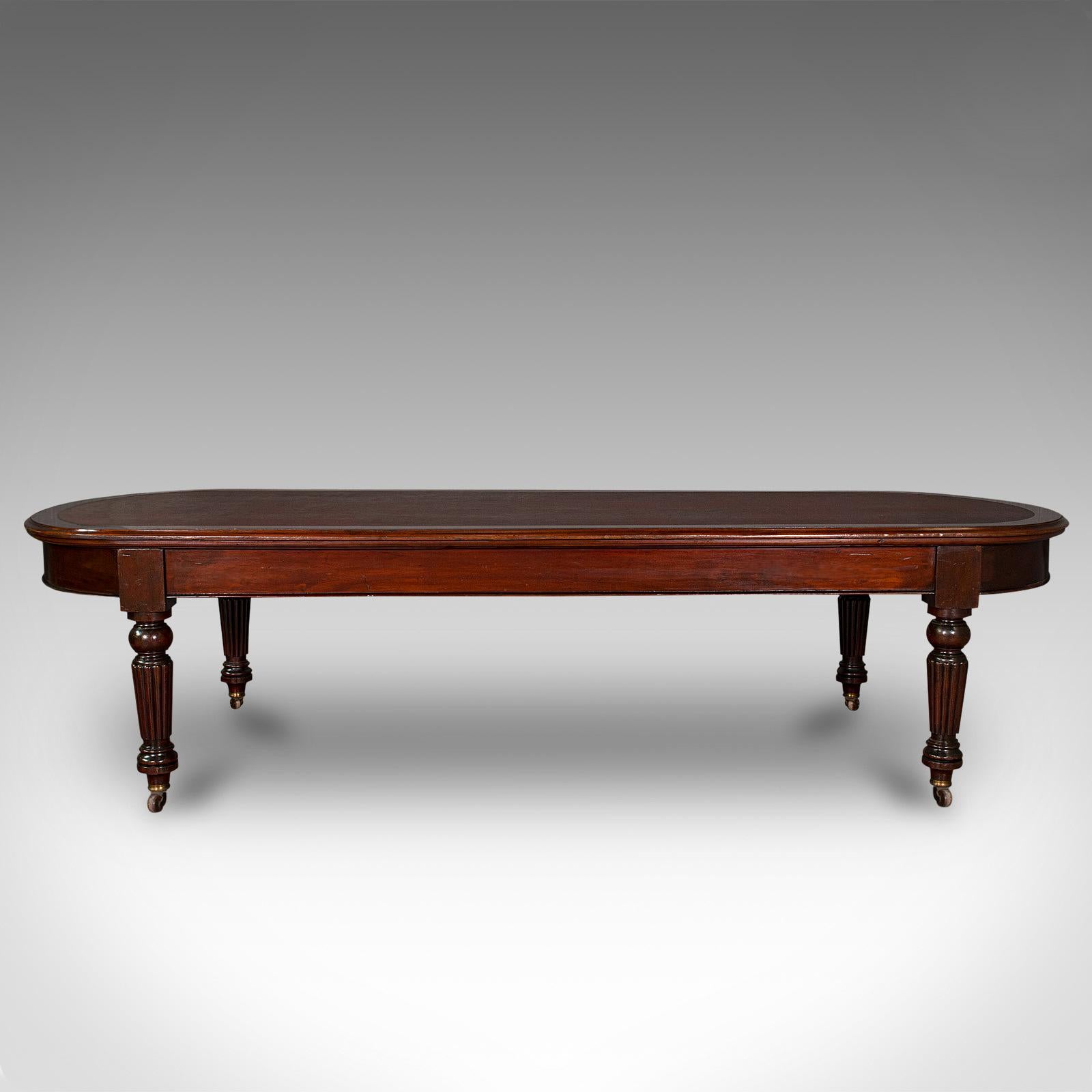 This is a large antique library table. An English, mahogany boardroom or dining table with demi-lune ends, dating to the Victorian period, circa 1850.

Exceptional table of grand 10' proportion and finish fit for the boardroom or dining