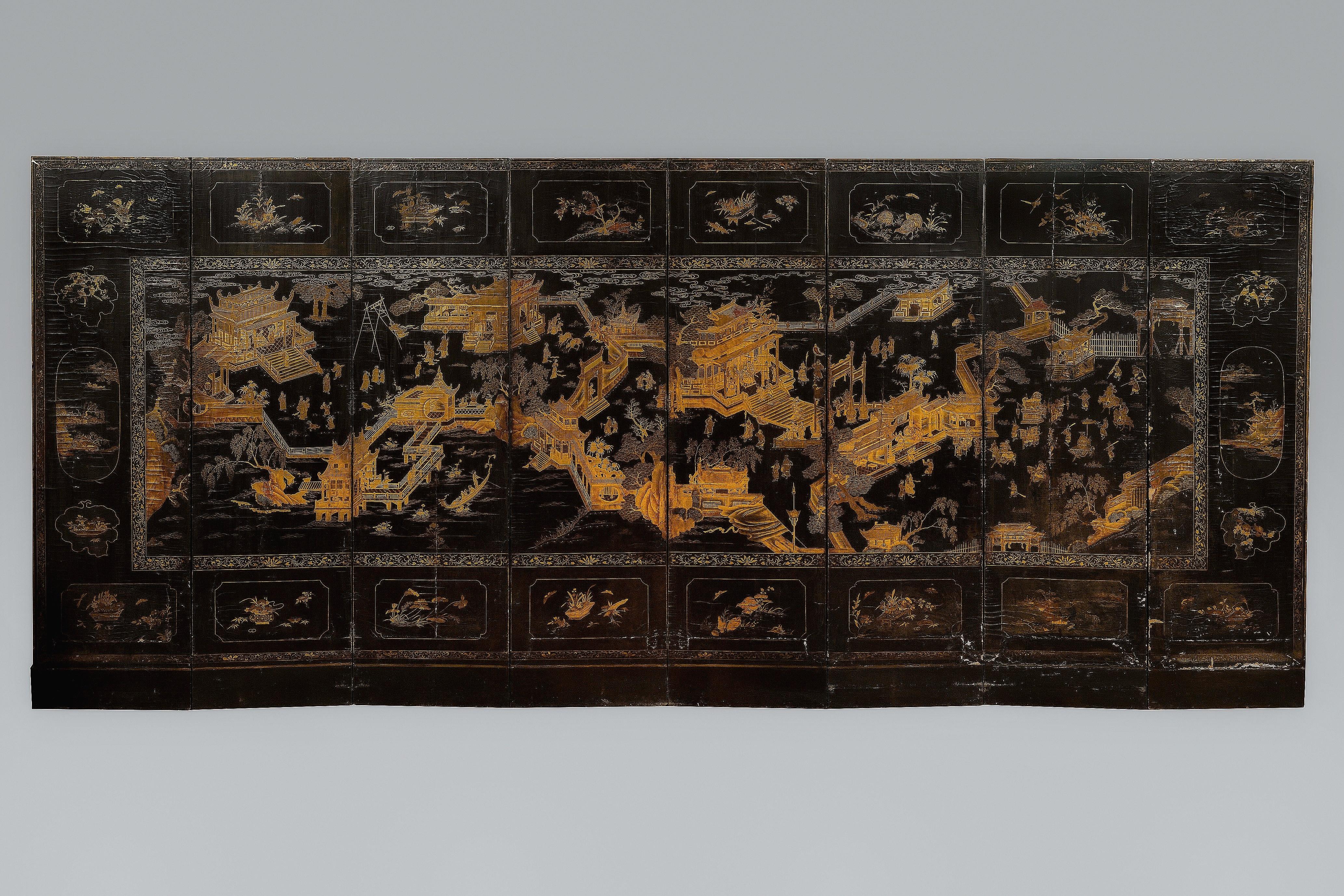 Very large eight-panel sreen with richly decorated landscape vedutas, partly architectural. Very fine execution in coromandel lacquer partially accented with gold. The screen is executed correspondingly on both sides. Large frame with Chinese scenes