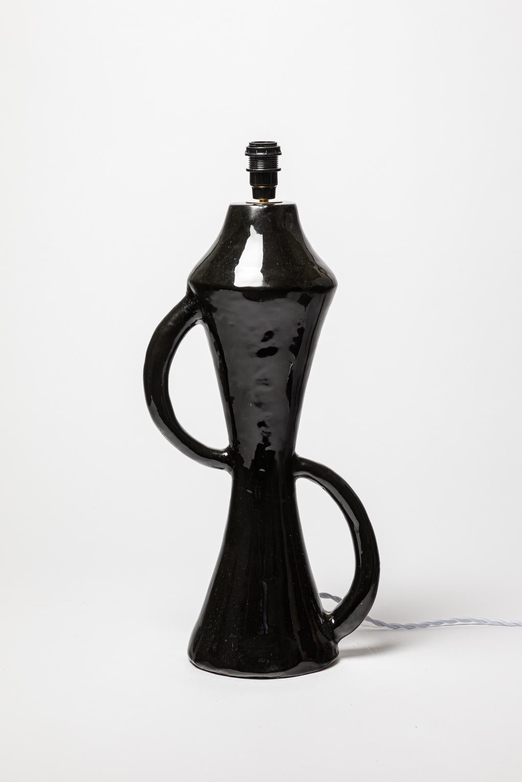 In the style of Georges Jouve

Large 20th century abstract ceramic table lamp

black ceramic glaze color

Original perfect condition

realised circa 1970

Electrical system is ok

Ceramic height 45 cm
Height with Electrical system 51 cm
Large 22