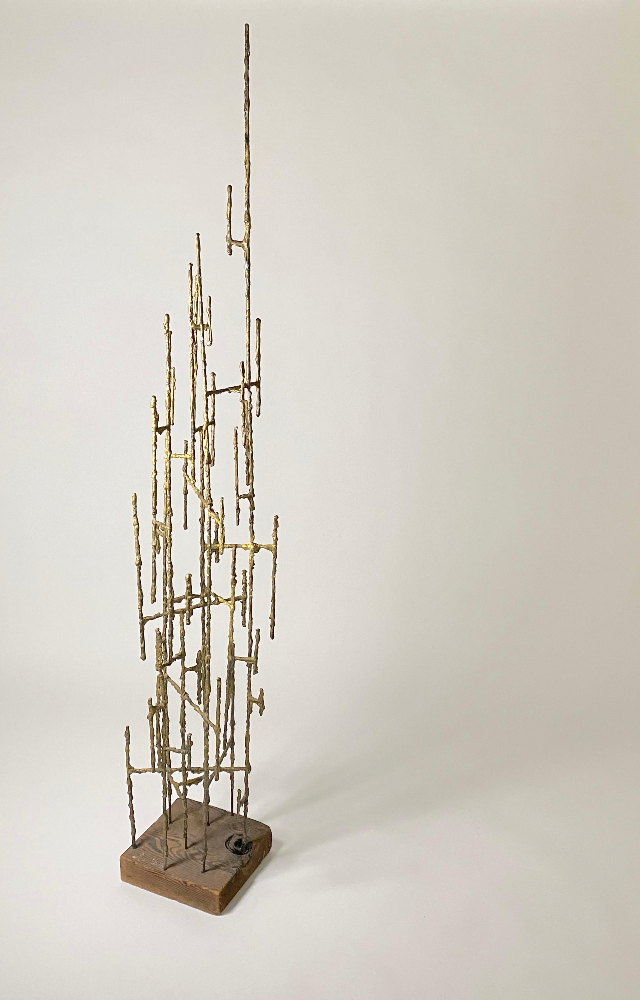 81 inches tall, Abstract floor sculpture in welded metal with a resin outer drip coating in a soft bronze / gold color on a wooden plinth base. The work has the organic aesthetic similar to the work of Harry Bertoia's, signed by the artist, but it