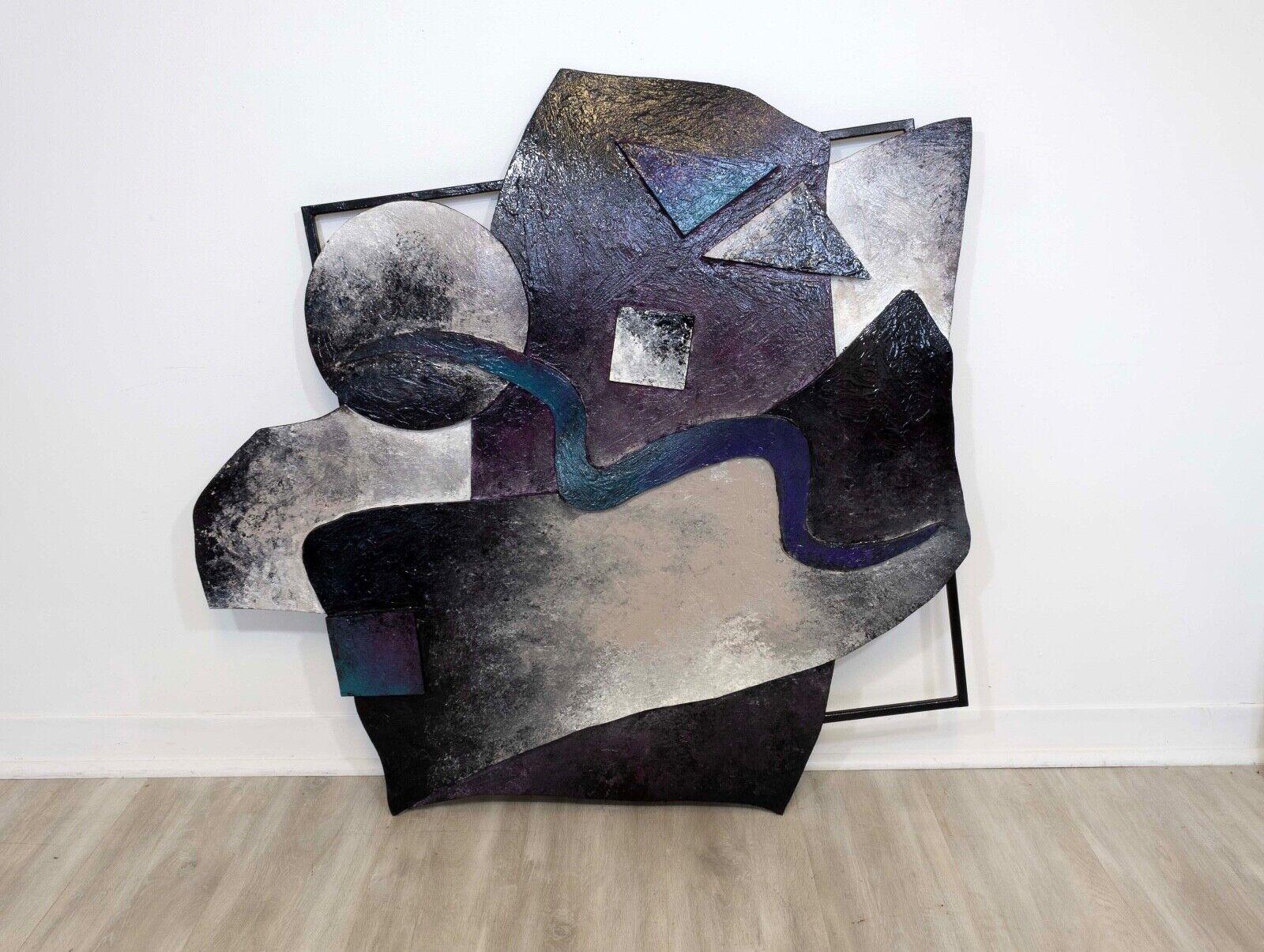 This large Abstract Galaxy Style Metal Wall Sculpture is a contemporary modern masterpiece that takes inspiration from the cosmos to create a mesmerizing visual experience. Crafted with precision and attention to detail, the metal sculpture