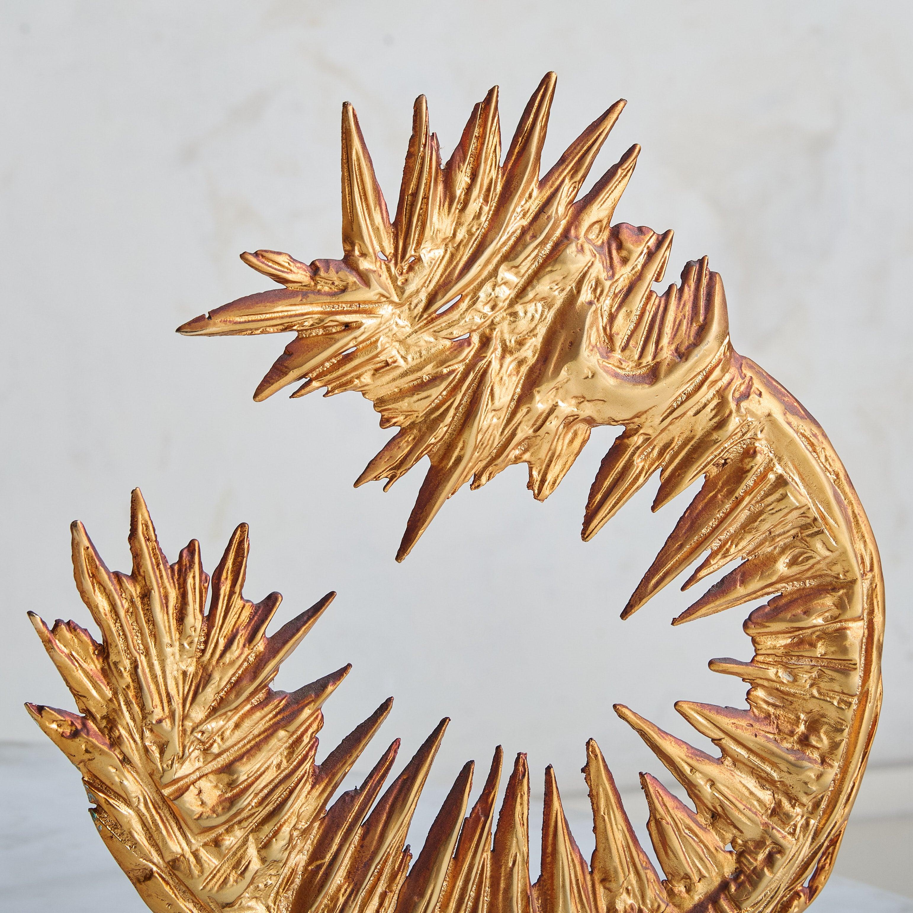 An abstract sculpture by French artist Philippe Cheverny, rendered in gilded metal. Its Brutalist form emerges from molten metal, poured and shaped into a freeform silhouette. Rests on a minimalist, rectangular base.

Condition: Great vintage