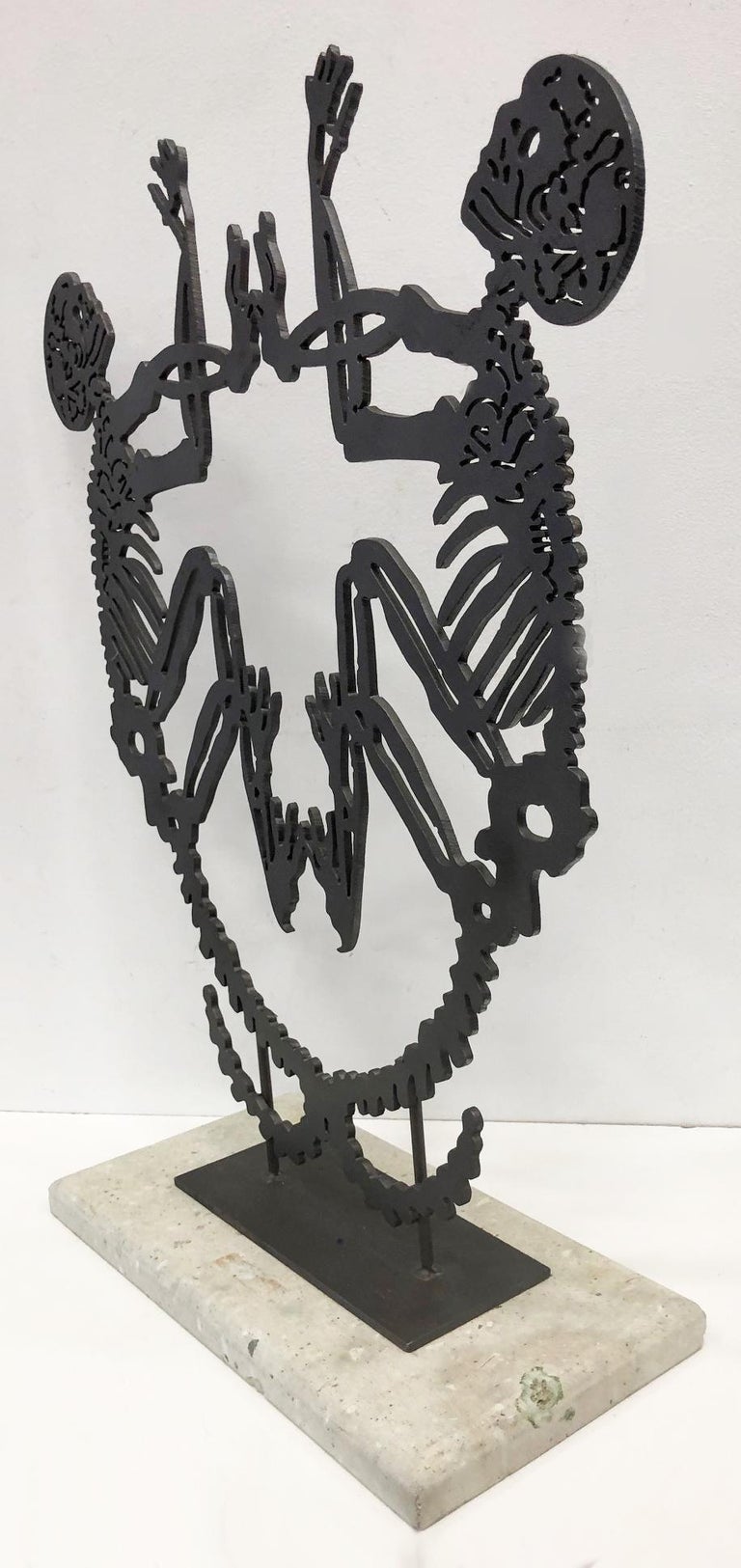 Large Abstract Metal Latin-American School sculpture with Skeletons

Offered for sale is a large abstract metal Latin-American School sculpture presented upon a stone base. The sculpture is substantial and creates a graphic impact.

 Measures: