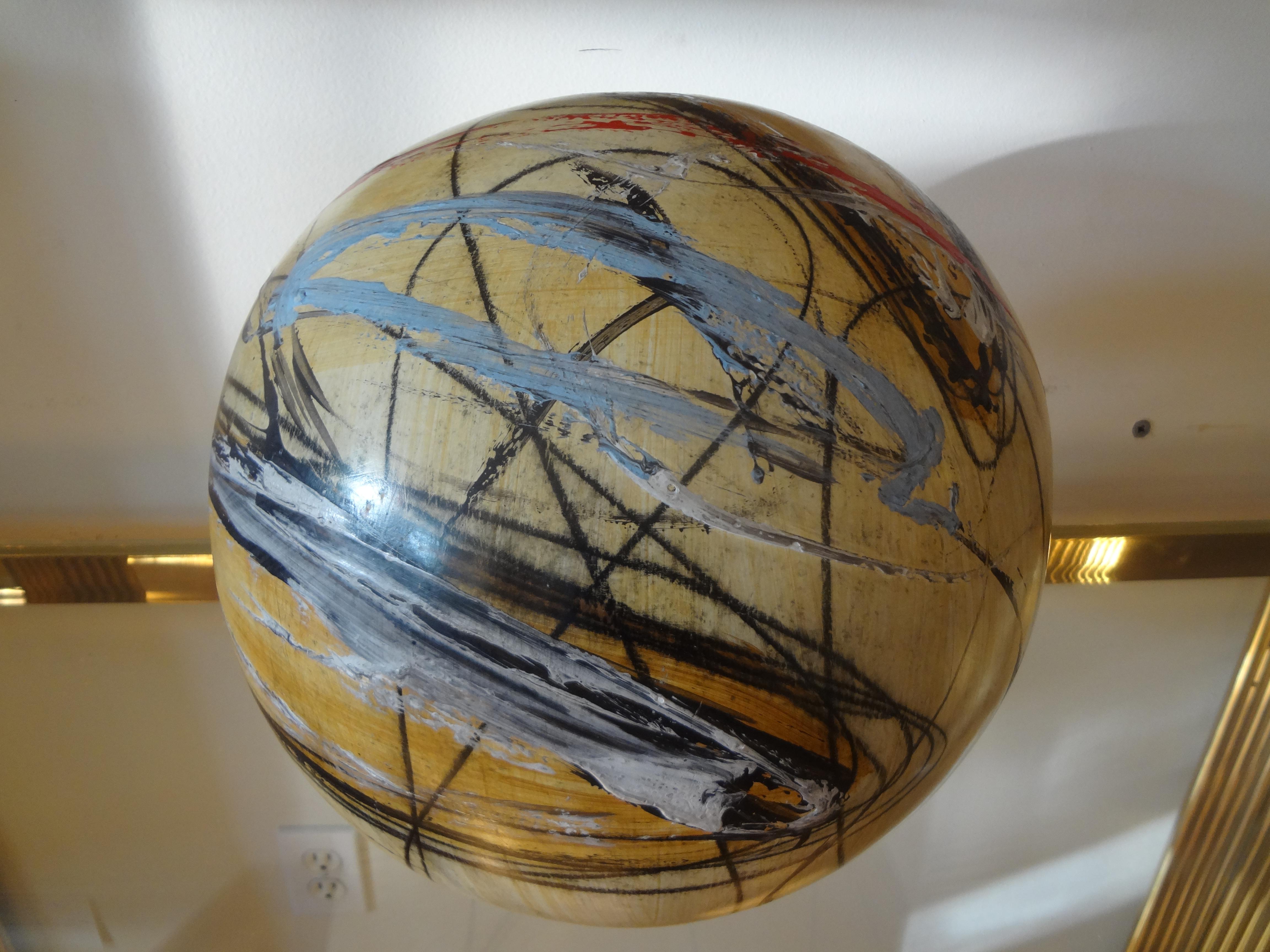 Interesting Mid-Century Modern hand decorated multicolored abstract sphere sculpture by Yuri Zatarain. This colorful vintage ceramic sphere sculpture is freestanding and large in size. Dimensions: 12