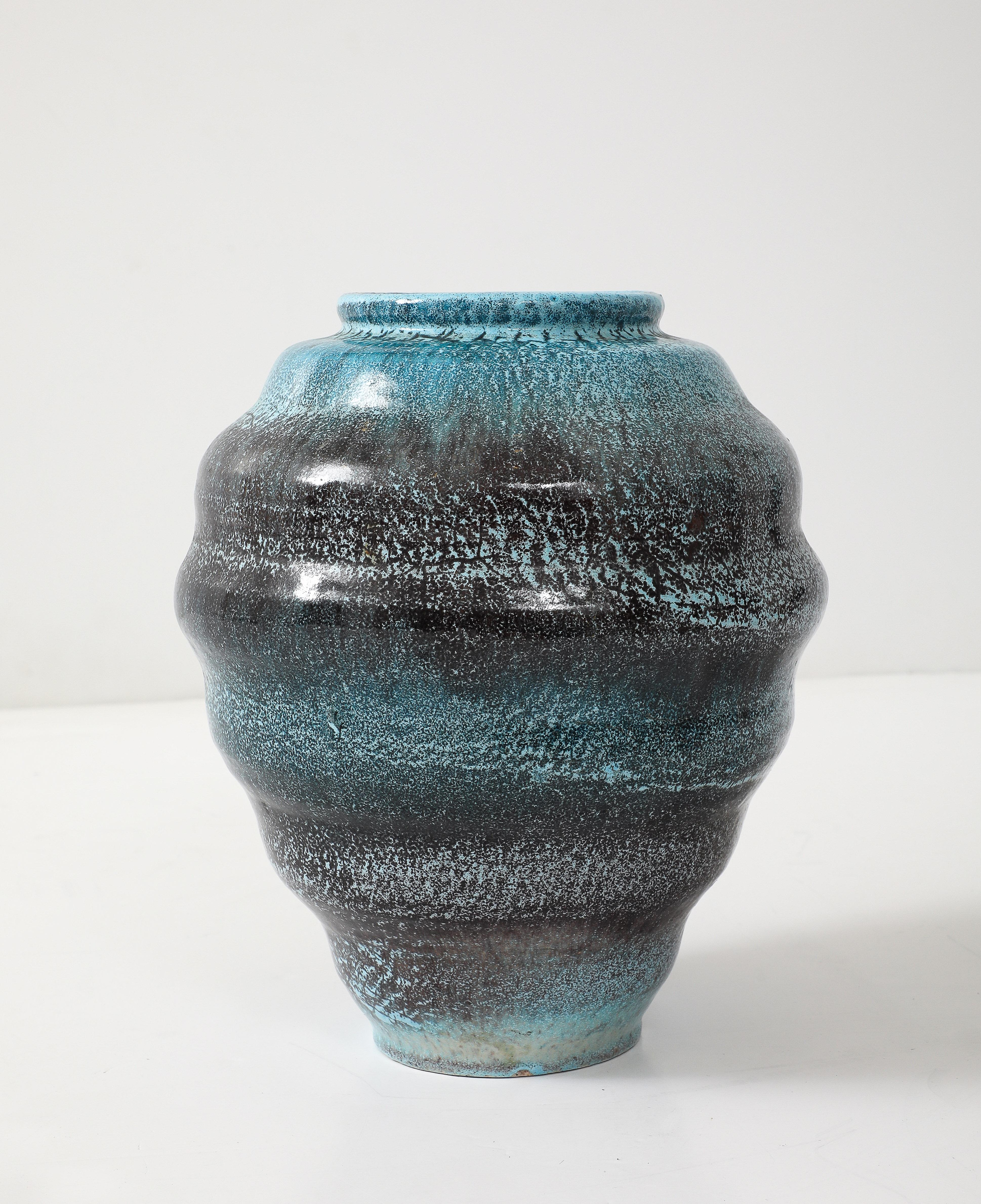 Large example of hand made Accolay pottery vessel featuring a speckeled glaze of Turquoise and Mink Brown.