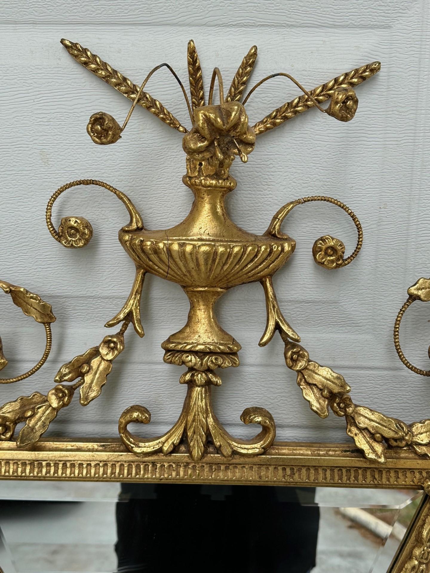 American Large Adams Style Carved Giltwood Octagonal Wall Mirror. For Sale