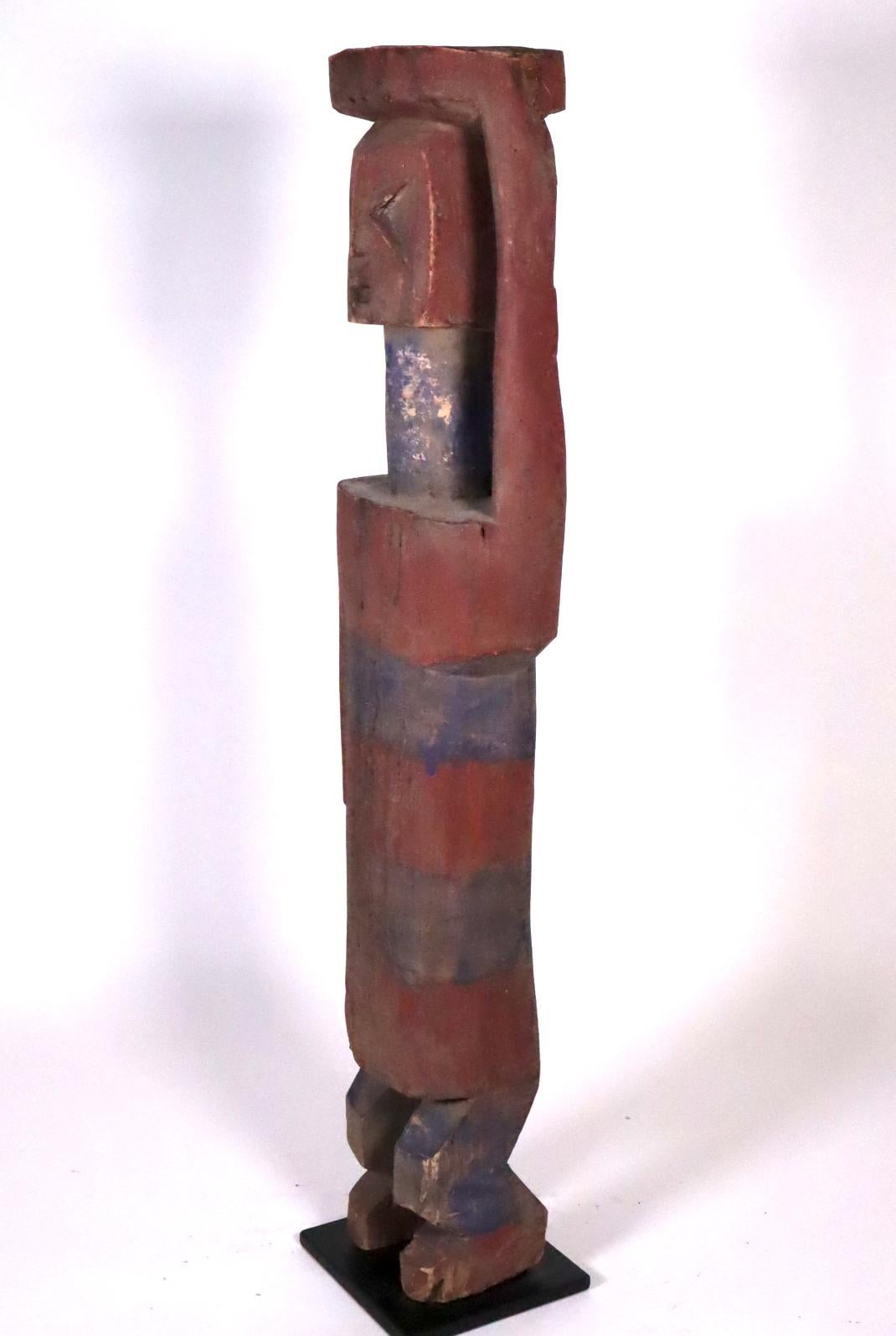 The largest Adan shrine figure we have ever seen at 27 1/2 inches high. Usually Adan figures are a third of this size or less. At this scale the sculptural skill of Adan artists is forcefully presented. The head is particularly interesting