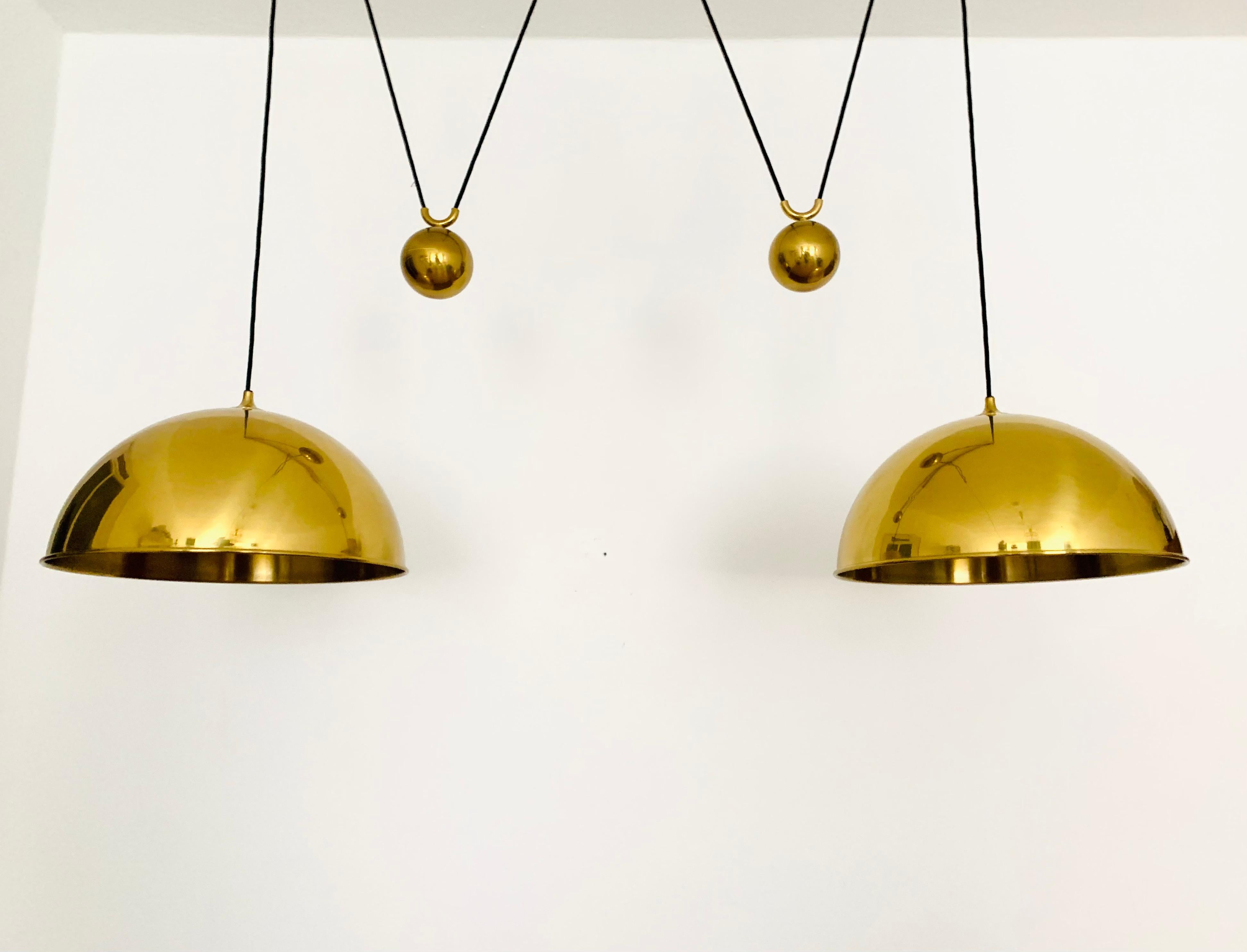 Mid-20th Century Large Adjustable Double Posa44 Brass Pendant Lamp by Florian Schulz For Sale