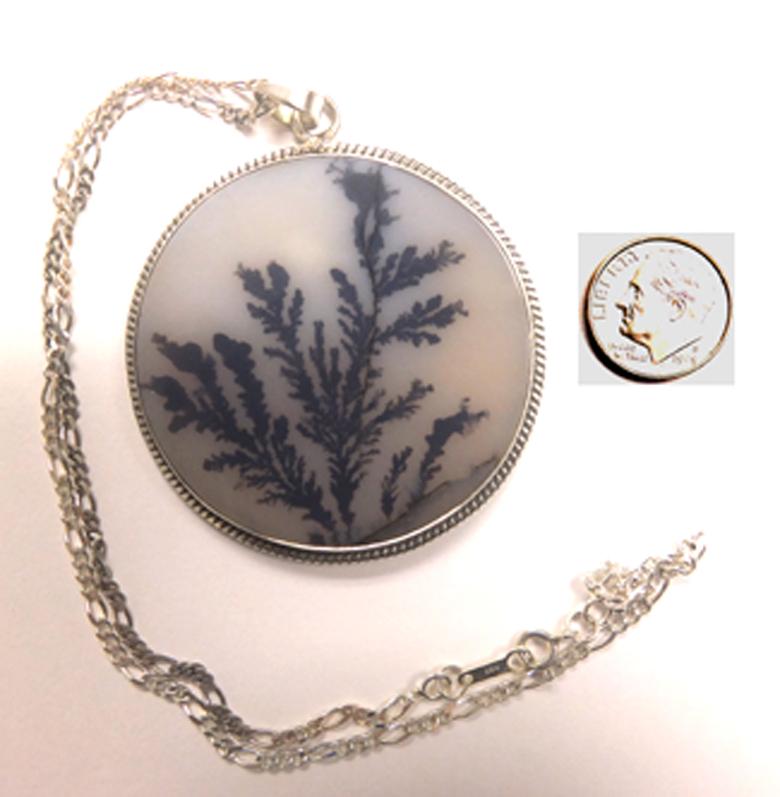 Large Slice of Dendritic Agate set in a Sterling Silver Pendant - with chain (stamped 925). 

We have seen pieces like this Dendritic Agate in Tucson of similar size and quality wholesaling for into the 5 figures (just for the piece and not even