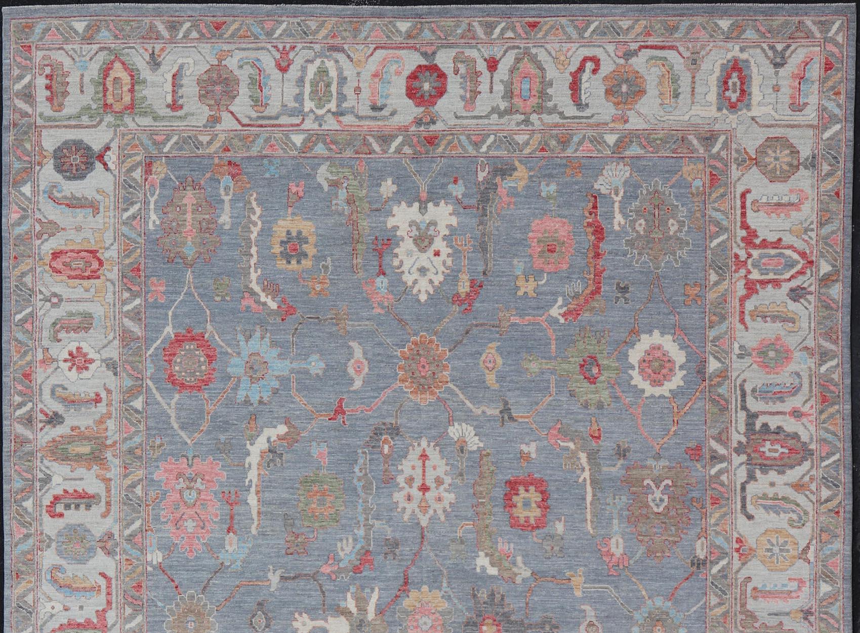 Hand-Knotted Large Afghan Oushak Design with All-Over Multi Colored Floral Design in Wool For Sale