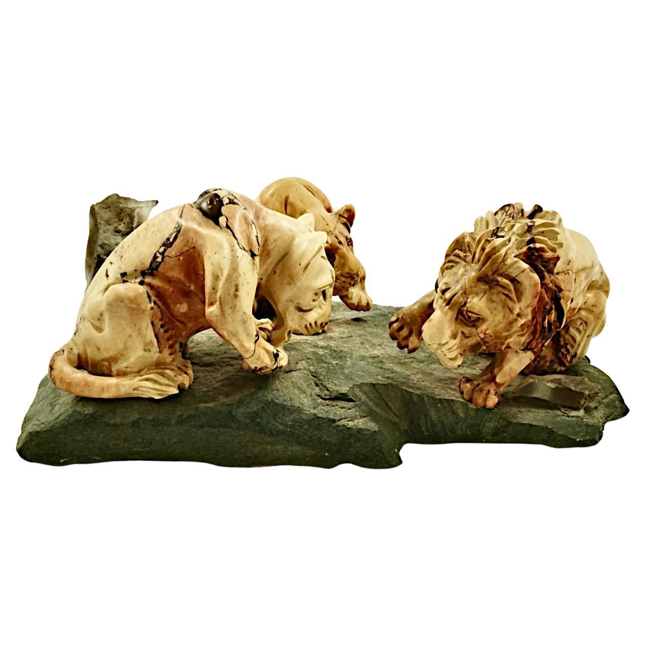 Heavy carved stone sculpture of a family of African lions. This unusual sculpture is in very good condition, the male lion is a little loose on the base. Measuring approximately length 26 cm / 10.2 inches, by width approximately 14 cm / 5.5 inches.