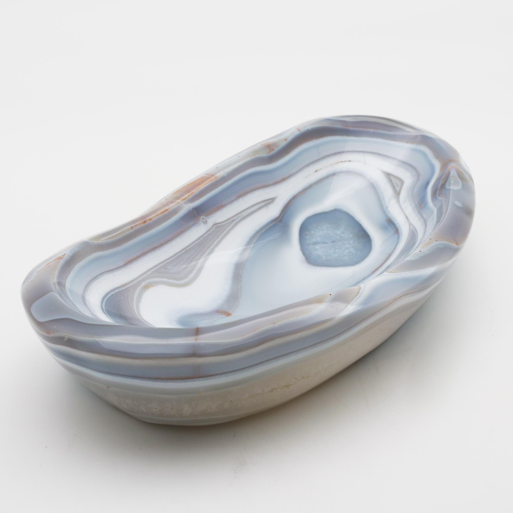 Beautiful, hand carved agate vide-poche from Madagascar, selected for its broad spectrum of colors and unusually large size. A very impressive desk or table item it can also be used as receptacle for keys etc, which is where the name vide-poche