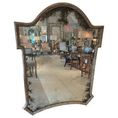 Large Aged Mirror with Carved Silver Giltwood Frame