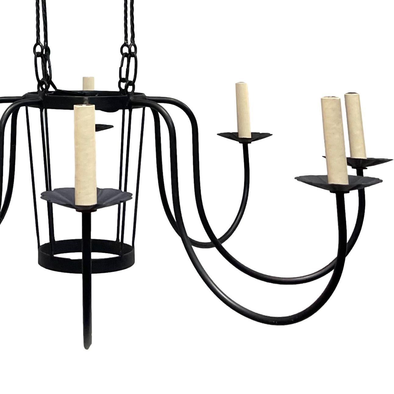A French circa 1970's painted air balloon eight-light chandelier with wrought iron arms.

Measurements:
Drop: 66