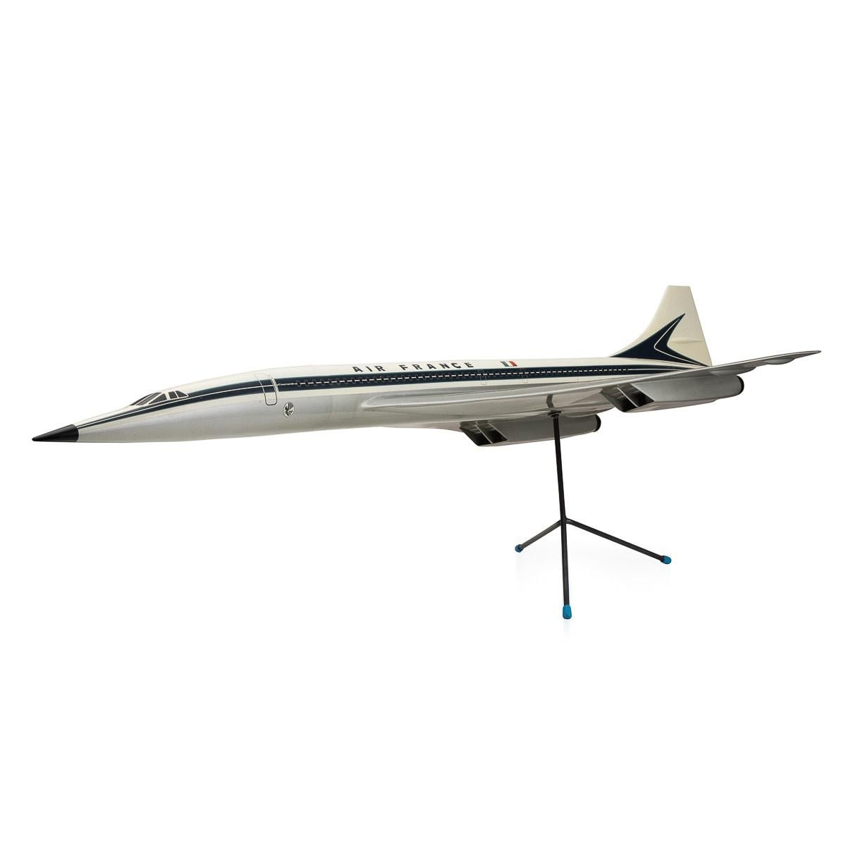 A splendid plastic composite model of a Air France Concorde in in blue and white mounted on a tripod stand by Space Models, circa 1990. This scaled down aircraft model was presented to one of Air france's top travel agents to use for marketing