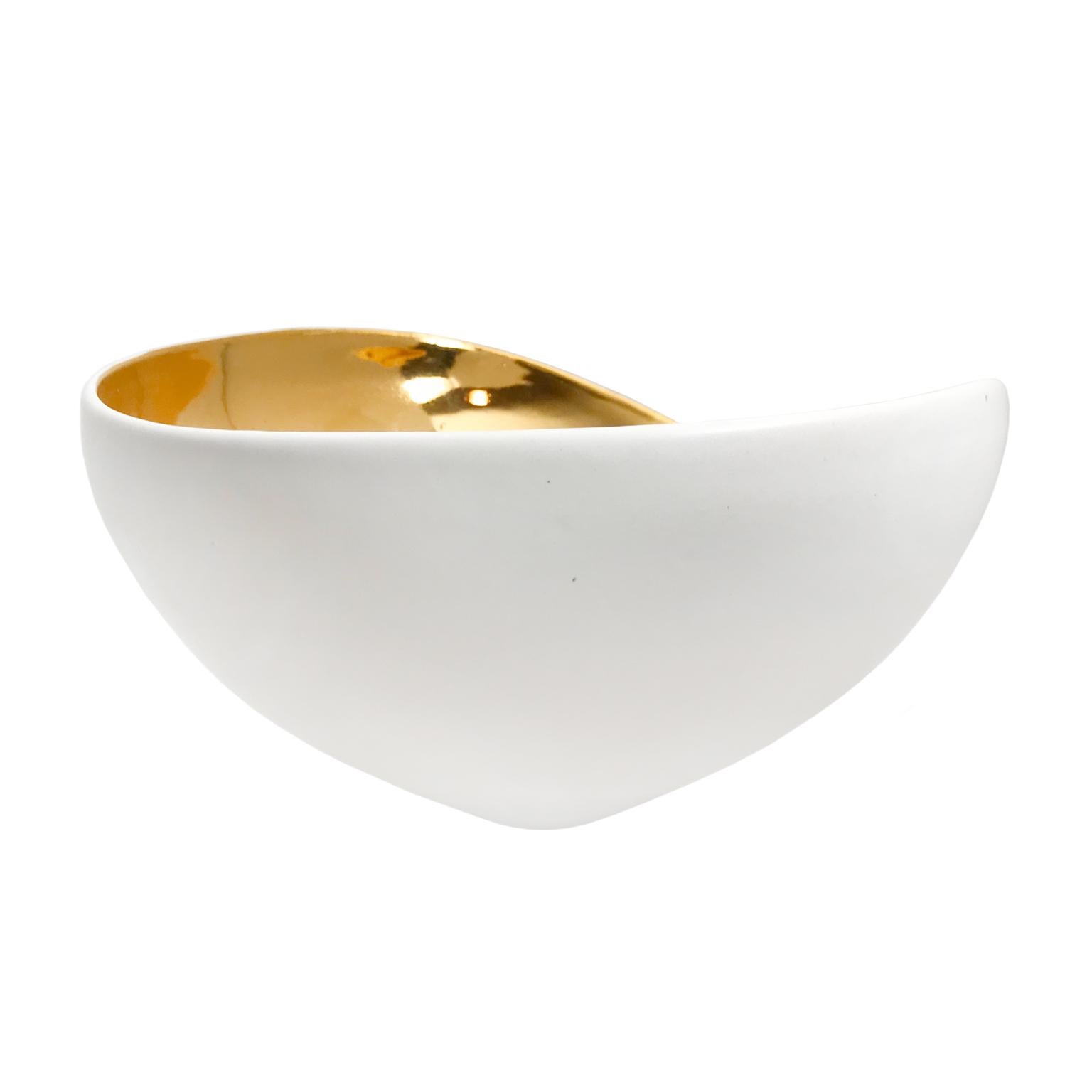 Large alabaster glaze asymmetrical ceramic bowl with 22-karat gold lustre interior by Sandi Fellman, 2018.

Veteran photographer Sandi Fellman's ceramic vessels are an exploration of a new medium. The forms, palettes, and sensuality of her photos
