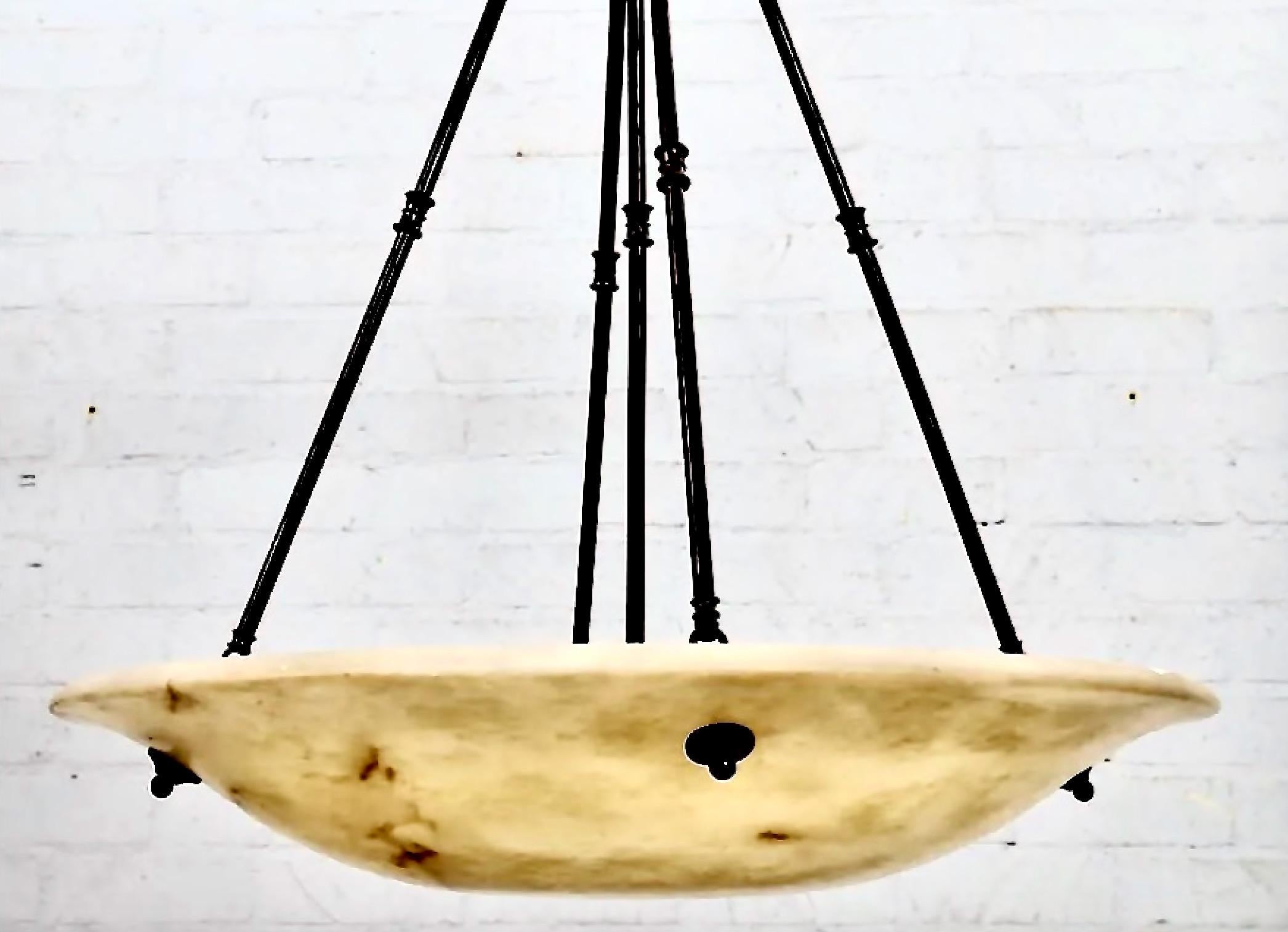 This is a very large carved alabaster and patinated steel plafonnier or ceiling fixture. The large alabaster bowl measures a full 30
