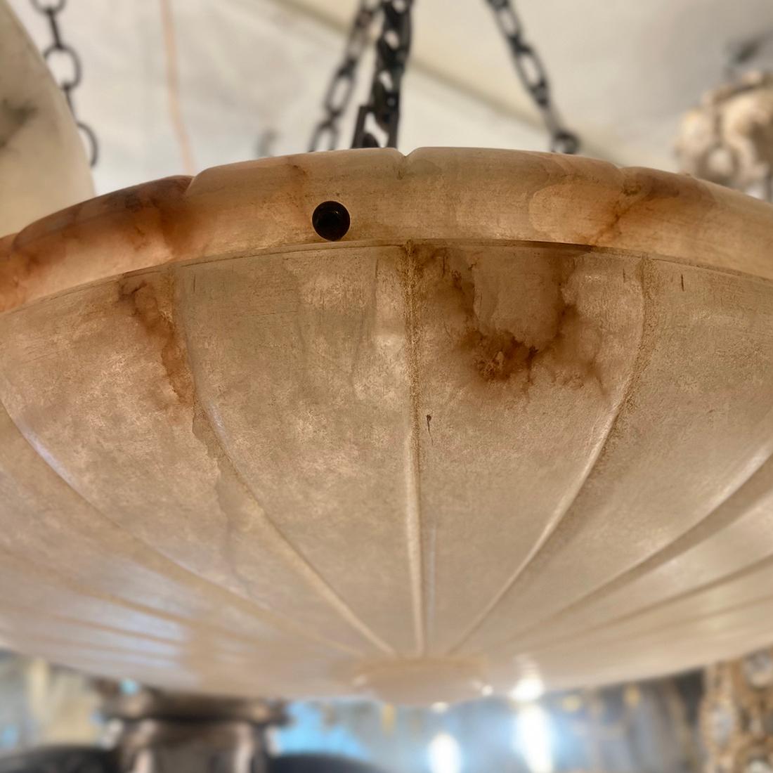 A circa 1940's French carved alabaster fixtures with interior lights.
Measurements:
Diameter: 24″
Drop: 30