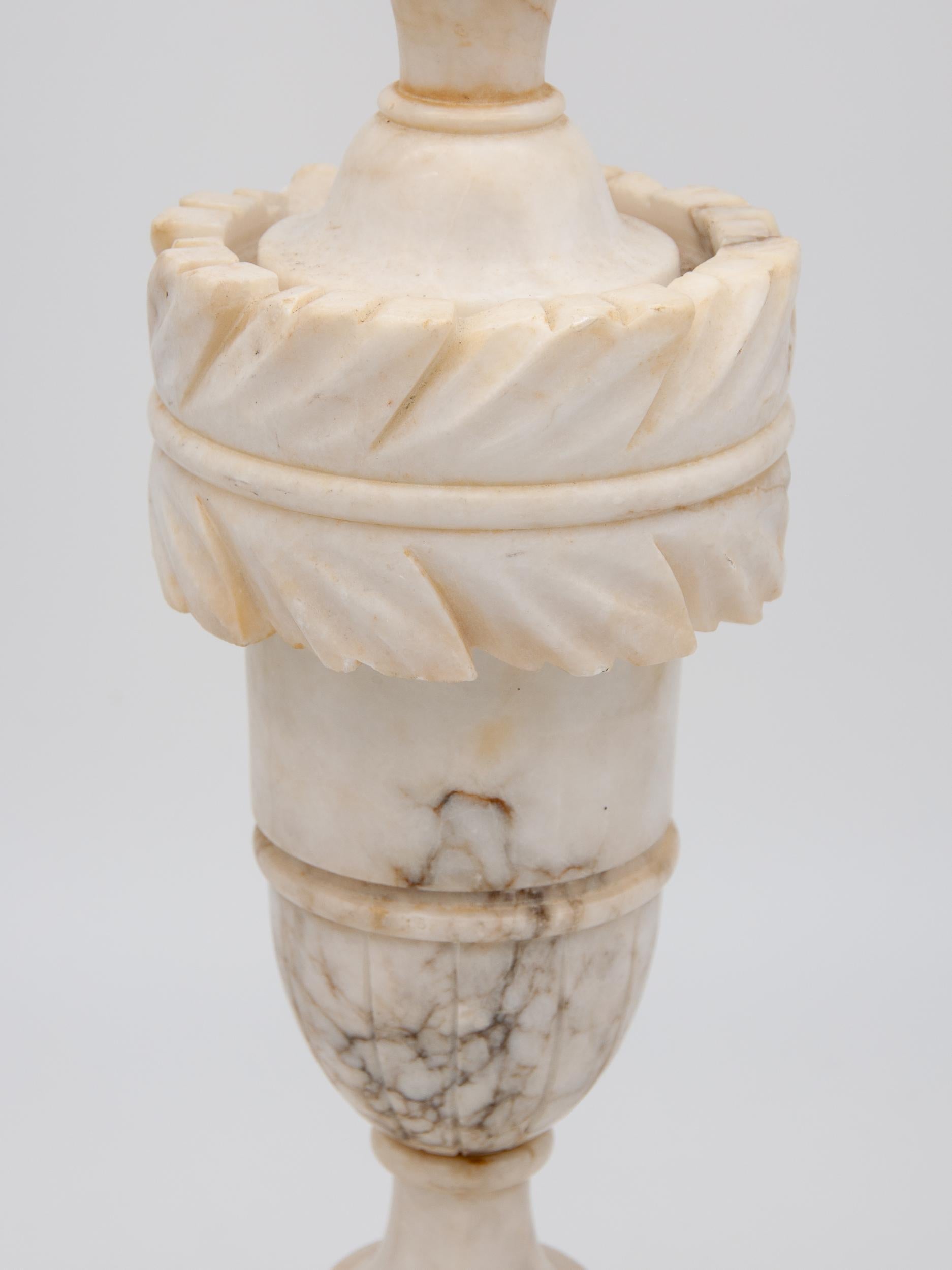 Large alabaster neoclassical style urn lamp. Some gray coloring. Losses to the back, please see photos, early 20th century. Rewired. Harp and shade not included.