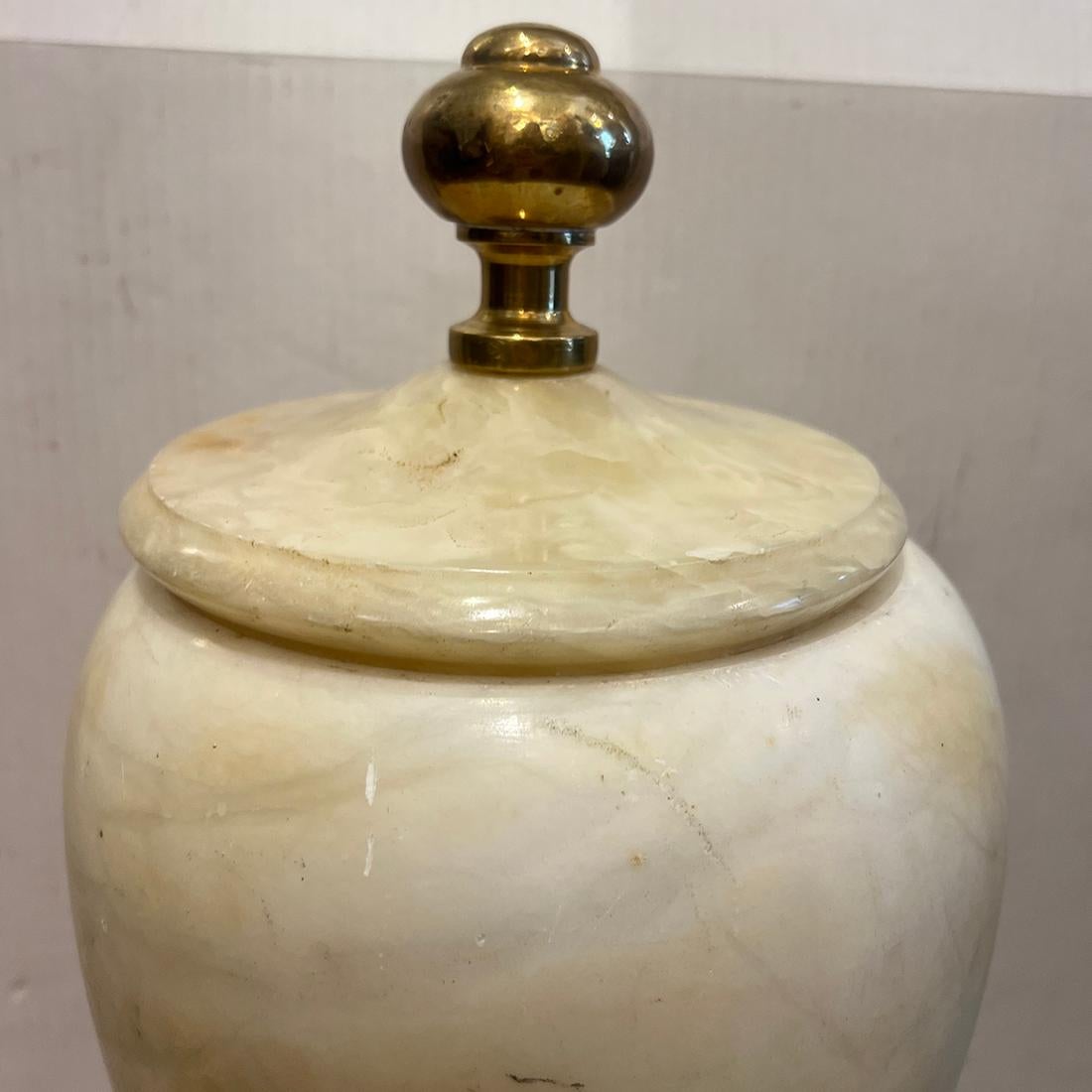 A circa 1930's French alabaster urn lamp with interior light.

Measurements:
Height: 22