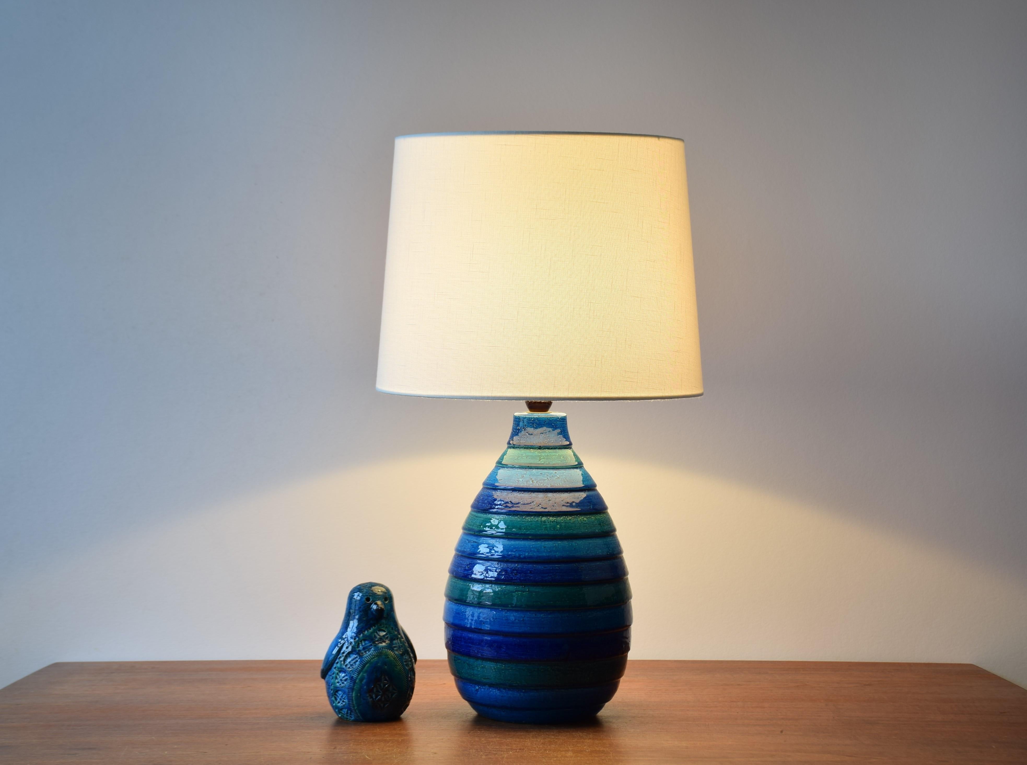 Tall vintage Bitossi ceramic table lamp designed by Aldo Londi.
It's made of ceramic with stripes in blue, turquoise and green shades.
The lamp is made in Italy, circa 1960s.

Sold without lampshade. The lampshade can be requested. 
It´s a new