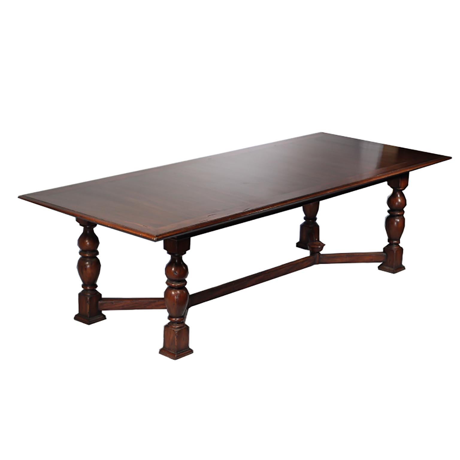 This is an original Alfonso Marina hand crafted dining table with hand carved legs and rich, Spanish Cedarwood grain throughout the piece. This piece is very large at 9 feet in length.
 