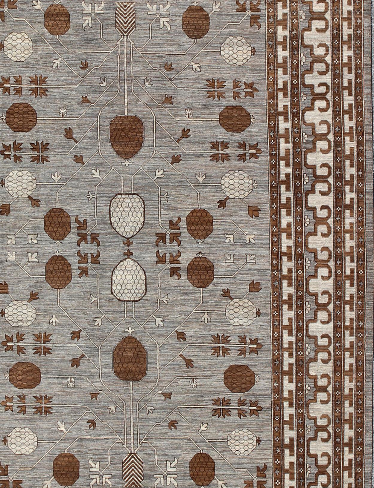 Large Khotan rug with all over Pomegranate Design. Keivan Woven Arts / rug MP-1709-1973, country of origin / type: Afghanistan / Khotan
Measures: 10'2 x 14'6.
This Khotan features an all over design flanked by a repeating pattern in the border. The
