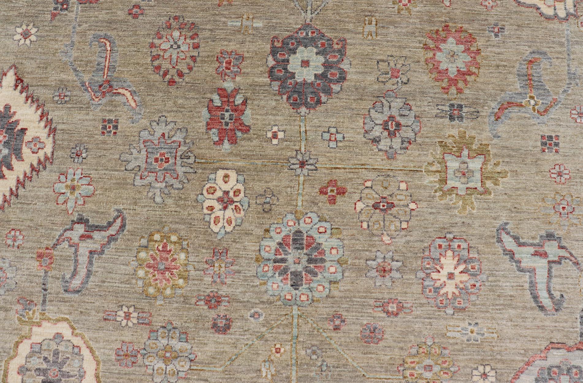 Hand-Knotted Large All-Over Designed Tabriz with A Yellow-Taupe Background and Muted Colors For Sale
