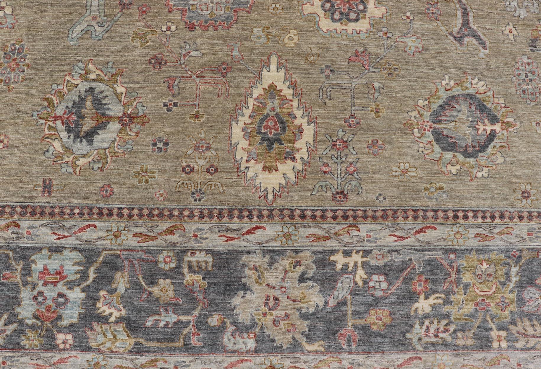 Large All-Over Designed Tabriz with A Yellow-Taupe Background and Muted Colors For Sale 1
