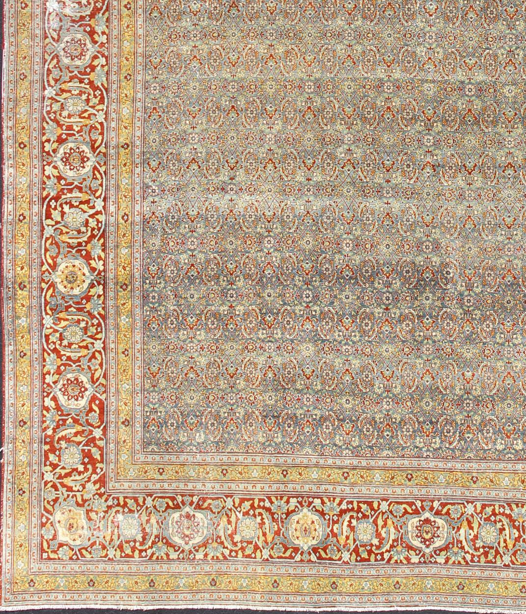 Red, border with gray, and blue Persian Tabriz antique rug in sub geometric design. keivan Woven Arts / rug zir-1, country of origin / type: Iran / Tabriz, circa 1910.
Measures: 13'6 x 16'2.
This antique Persian Tabriz carpet (circa early 20th