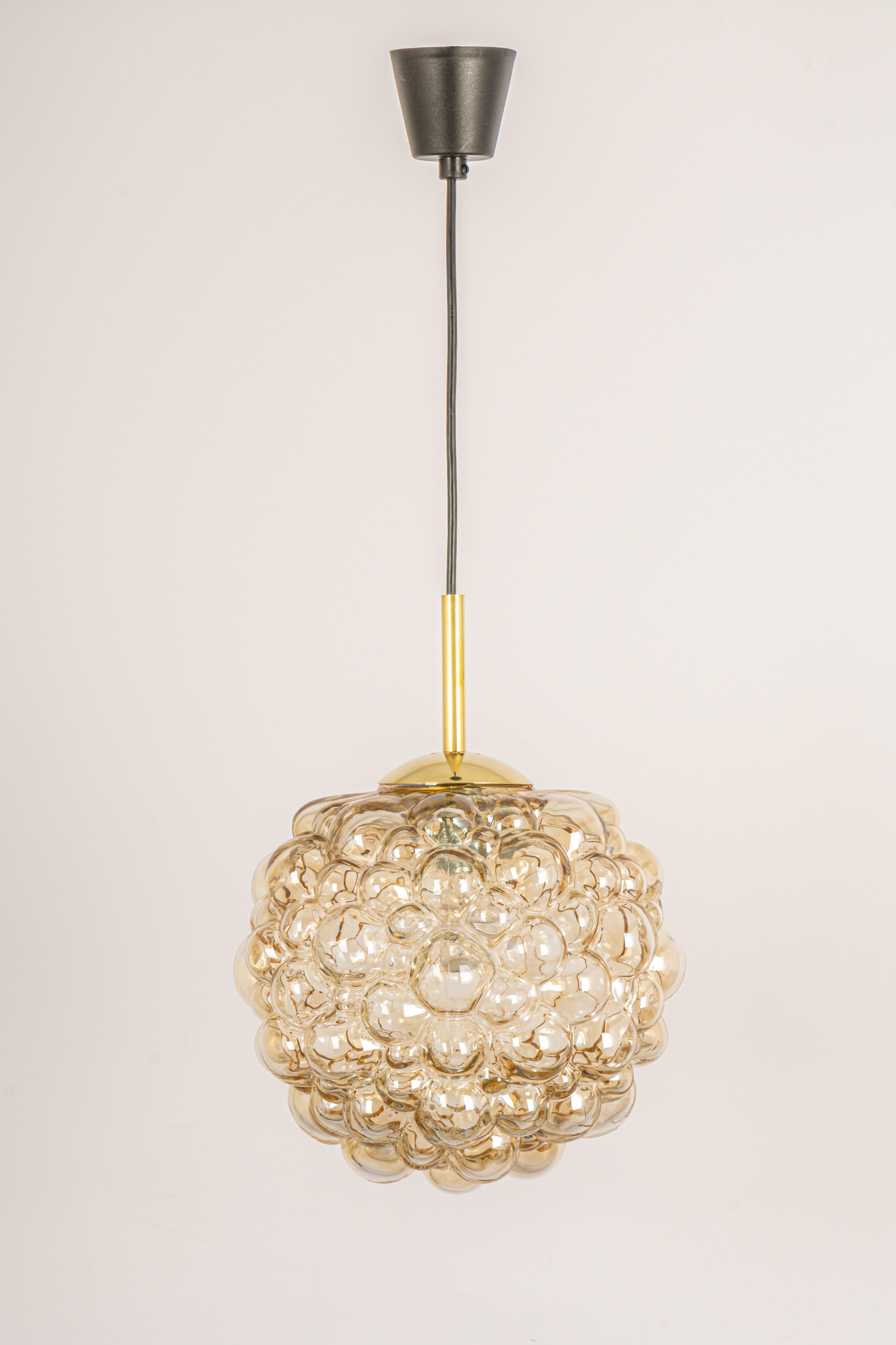 A large round with light smoke tone bubble glass pendant designed by Helena Tynell for Limburg, manufactured in Germany, circa 1970s

Sockets: It needs 1 x E27 standard bulb.
Light bulbs are not included. It is possible to install this fixture in